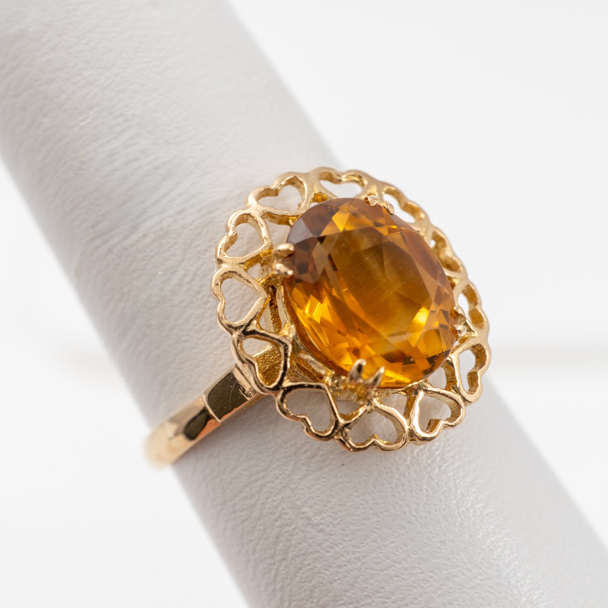 close up citrine ring gold hearts halo