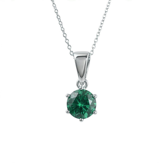 A silver pendant lab grown emerald necklace in a four-prong setting, suspended from a delicate silver chain against a plain white background.