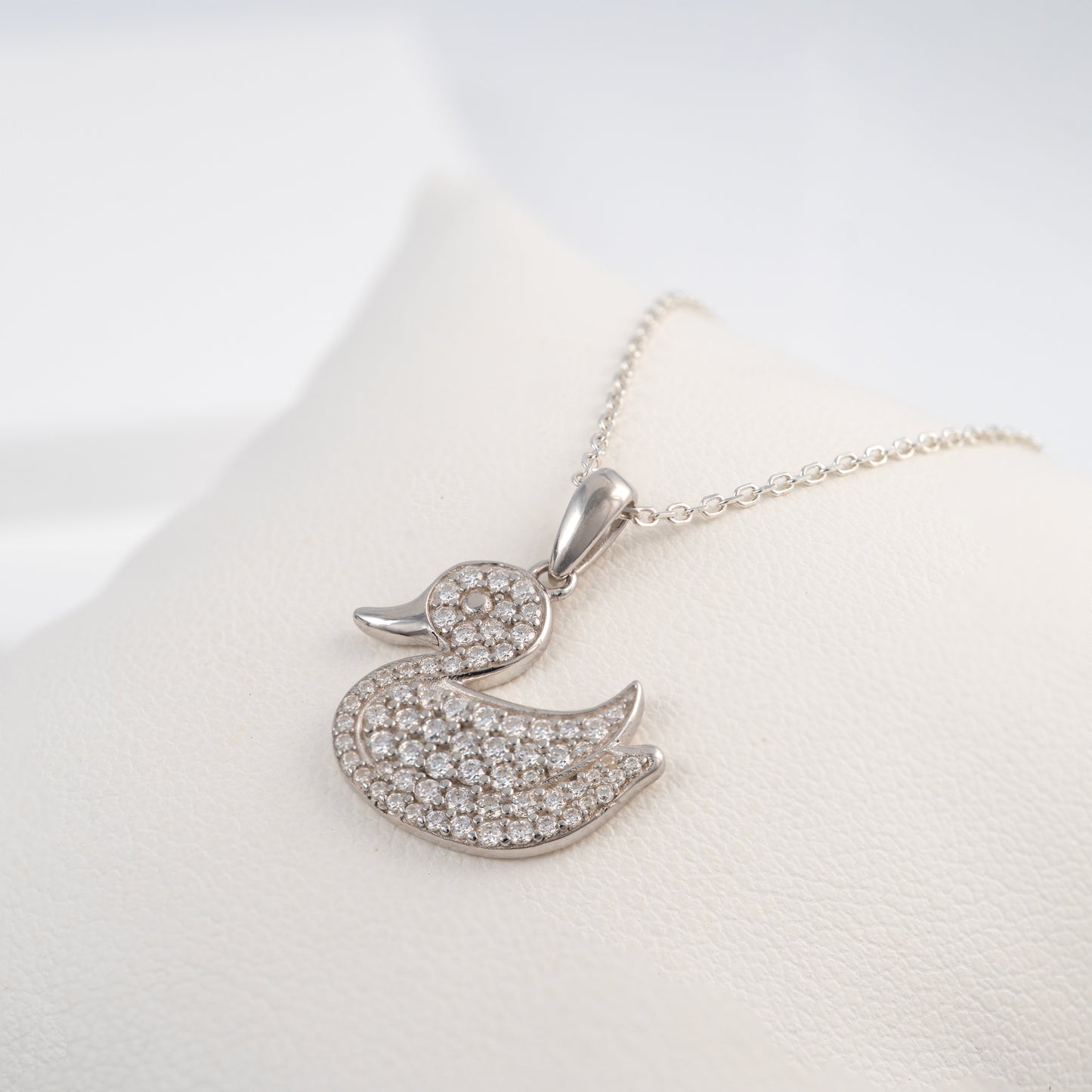 925 Silver necklace with moissanite set duck pendant on a white background