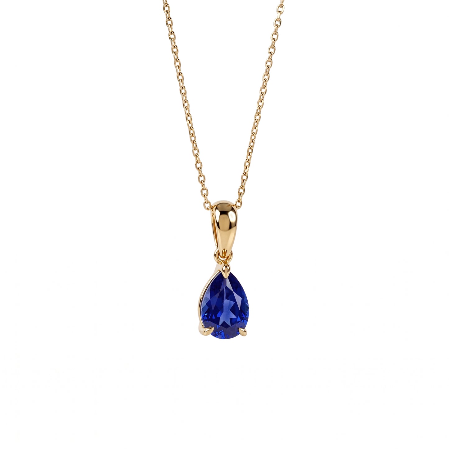 A gold chain necklace with a teardrop-shaped blue gemstone pendant, shown against a plain white background.