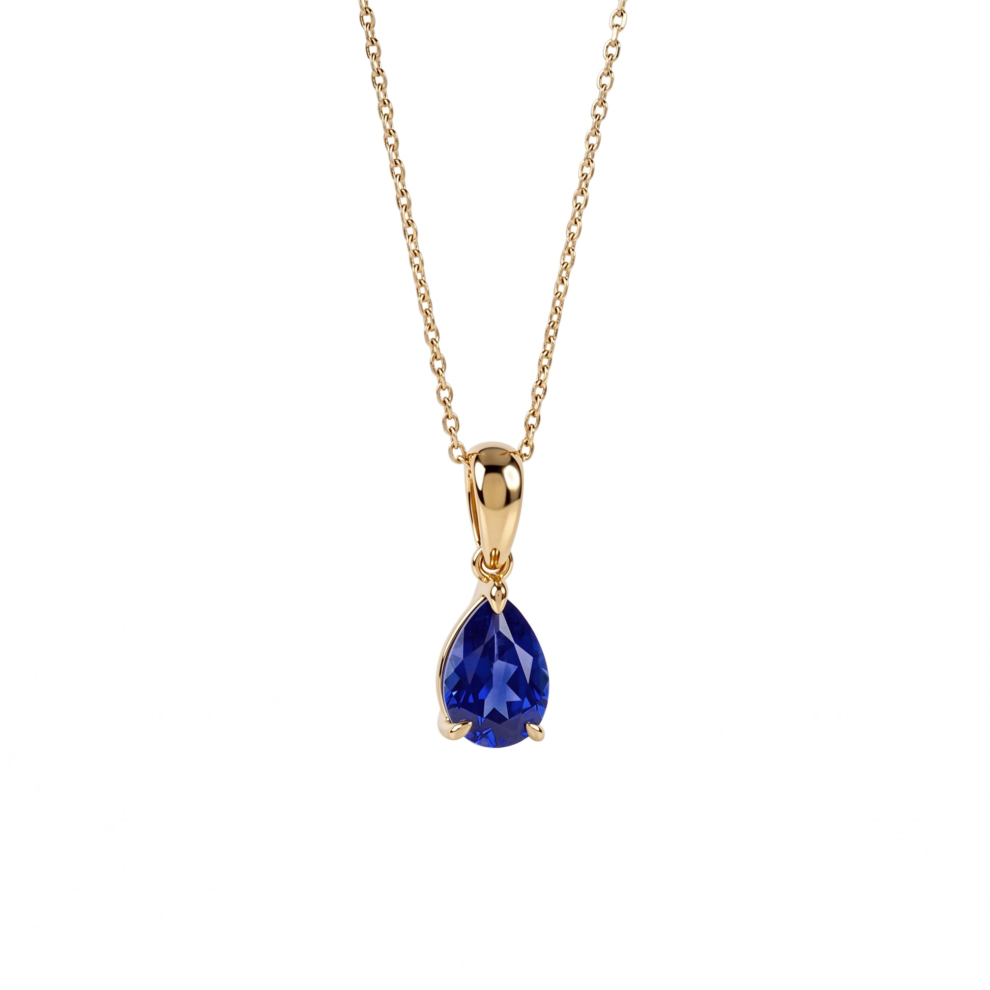 A gold chain necklace with a teardrop-shaped blue gemstone pendant, shown against a plain white background.