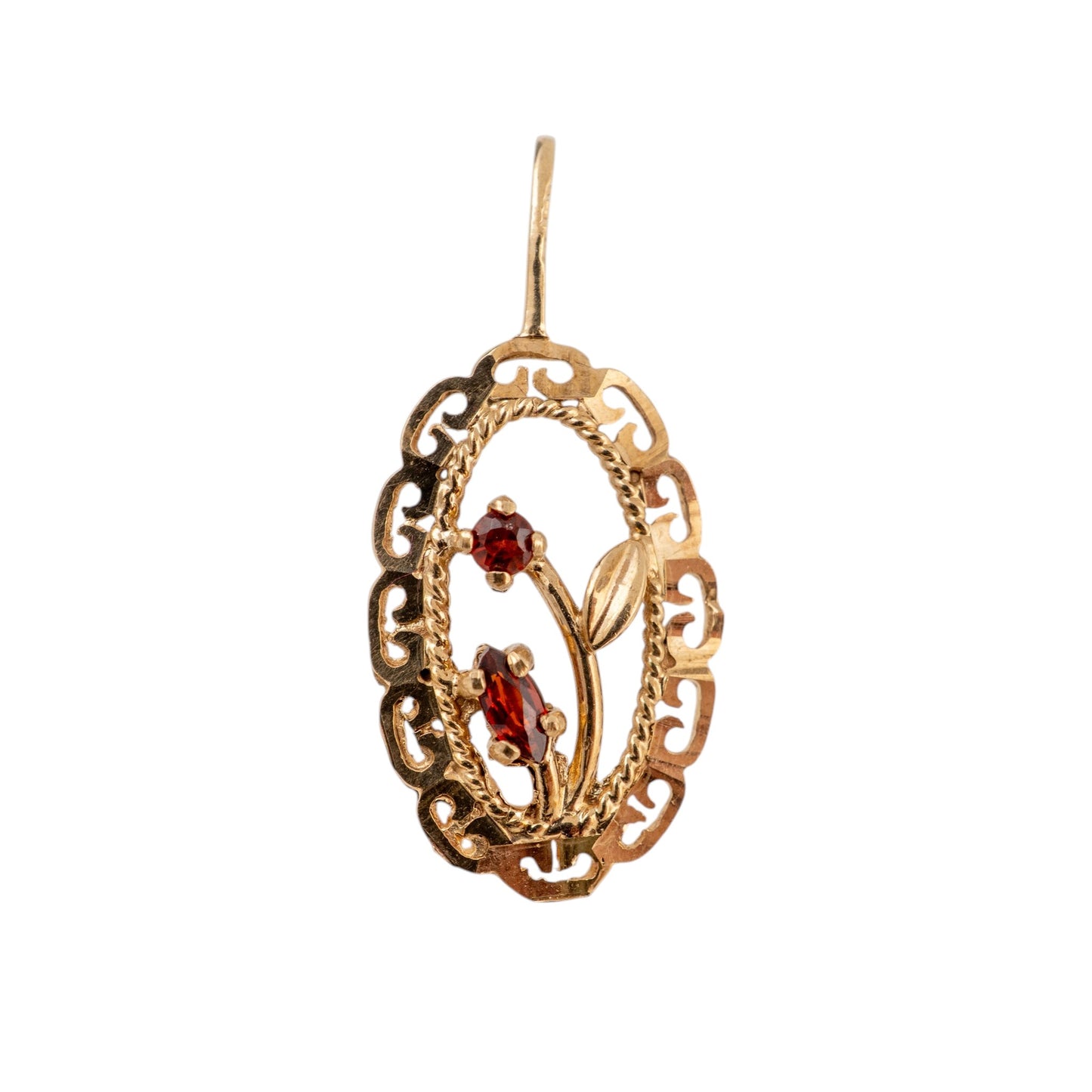 An antique-style gold filigree pendant featuring a decorative floral motif with two small red gemstones, shown against a plain white background.