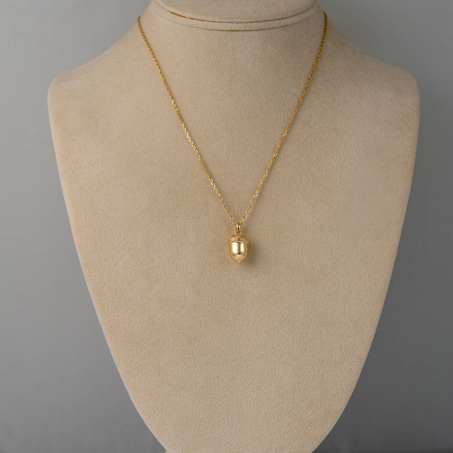 gold acorn necklace display bust