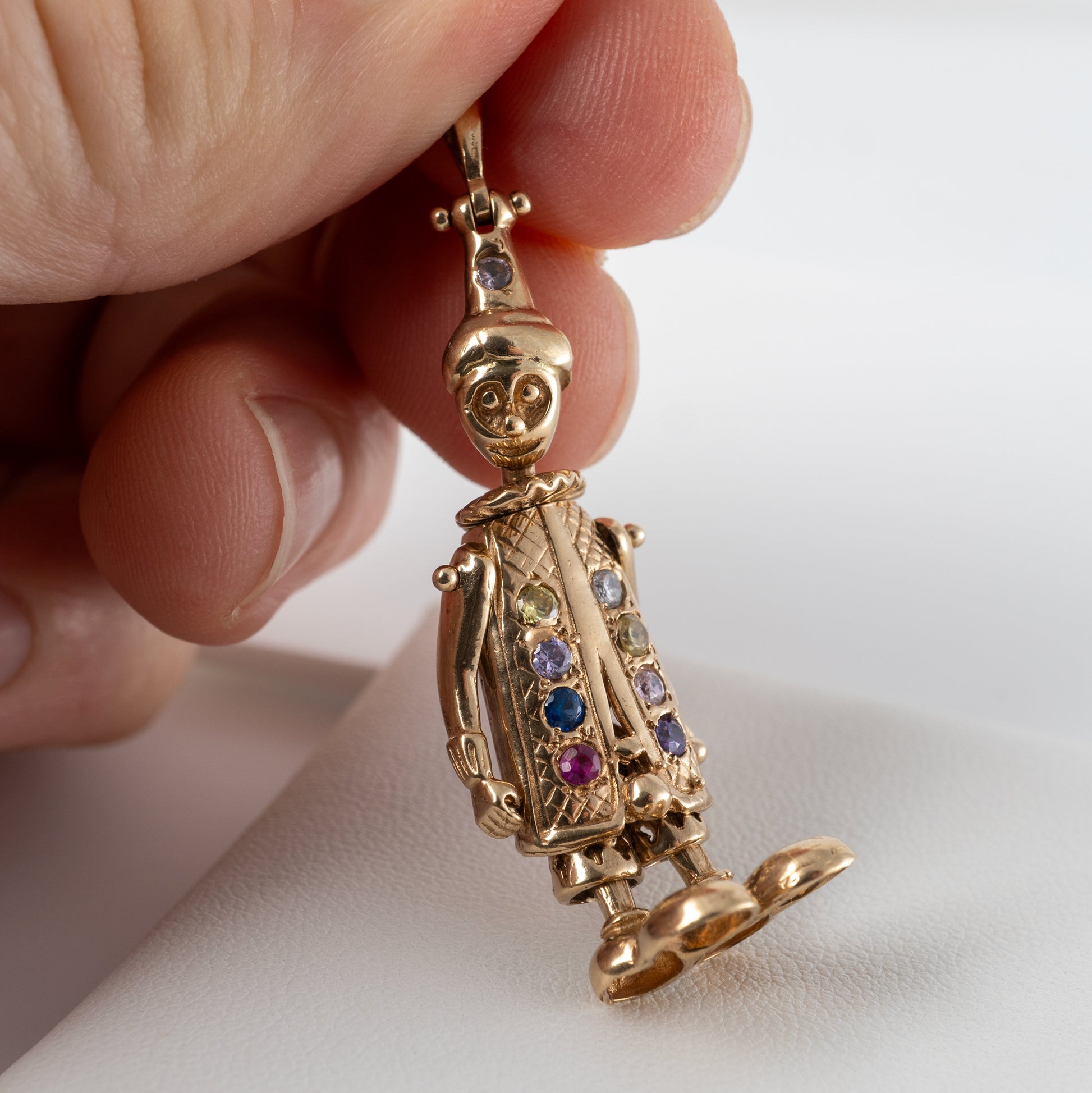 vintage gold clown pendant with colourful gemstones