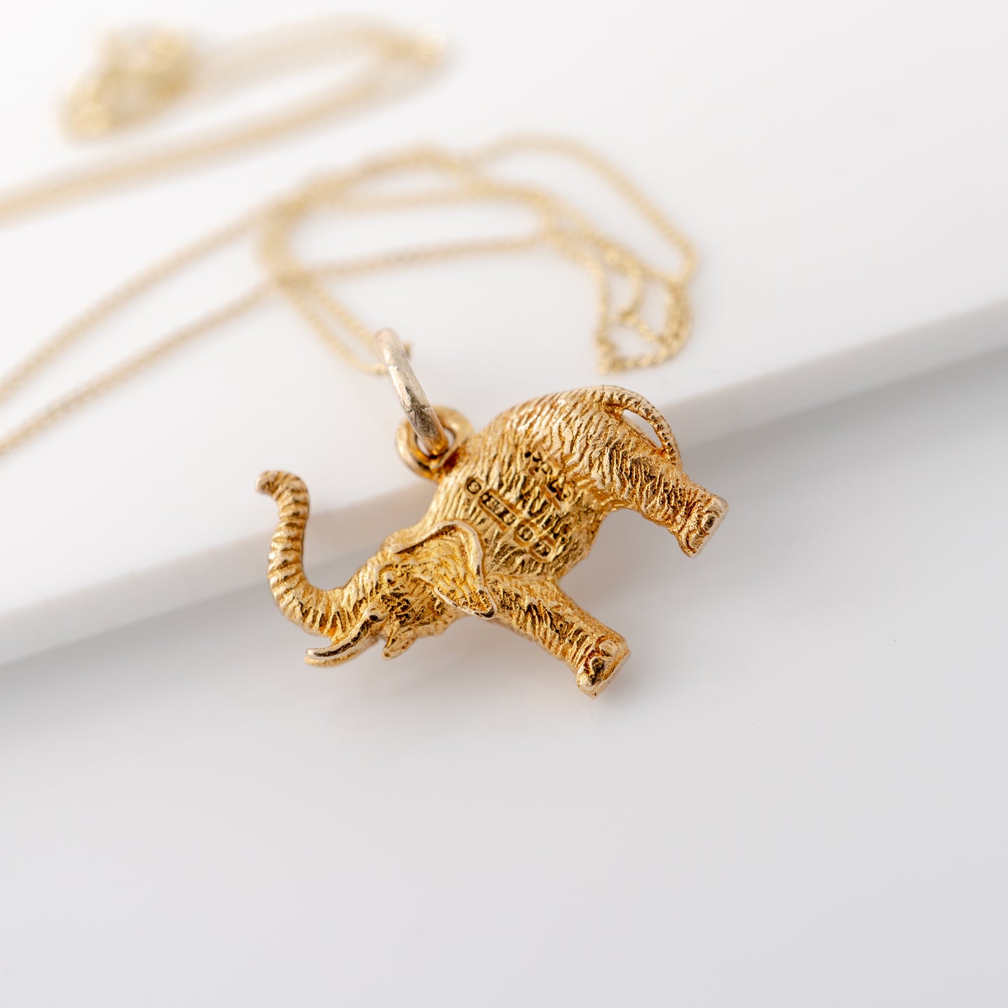 Vintage elephant necklace showing assay hallmarks 