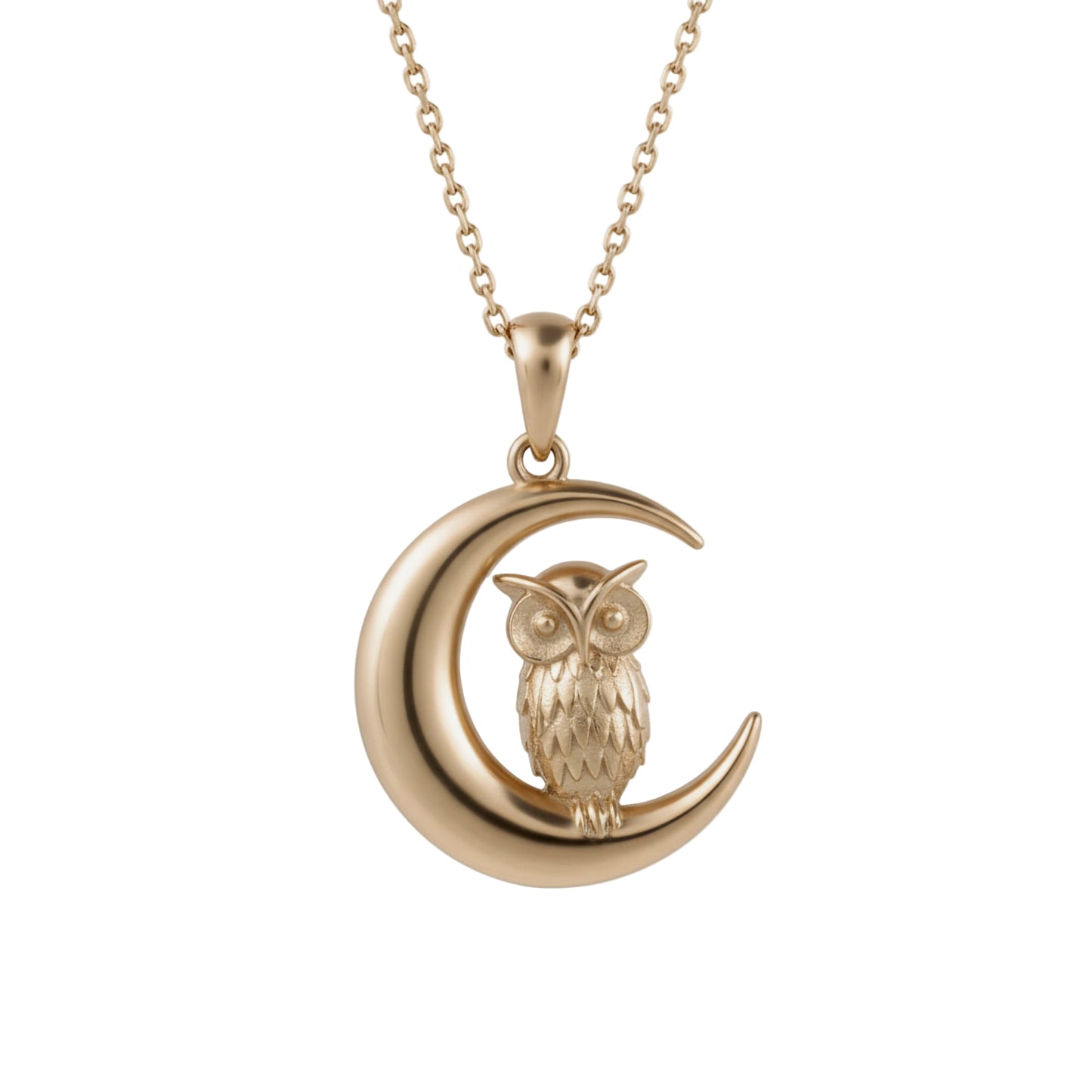Gold owl pendant on a crescent moon with a chain against a white background