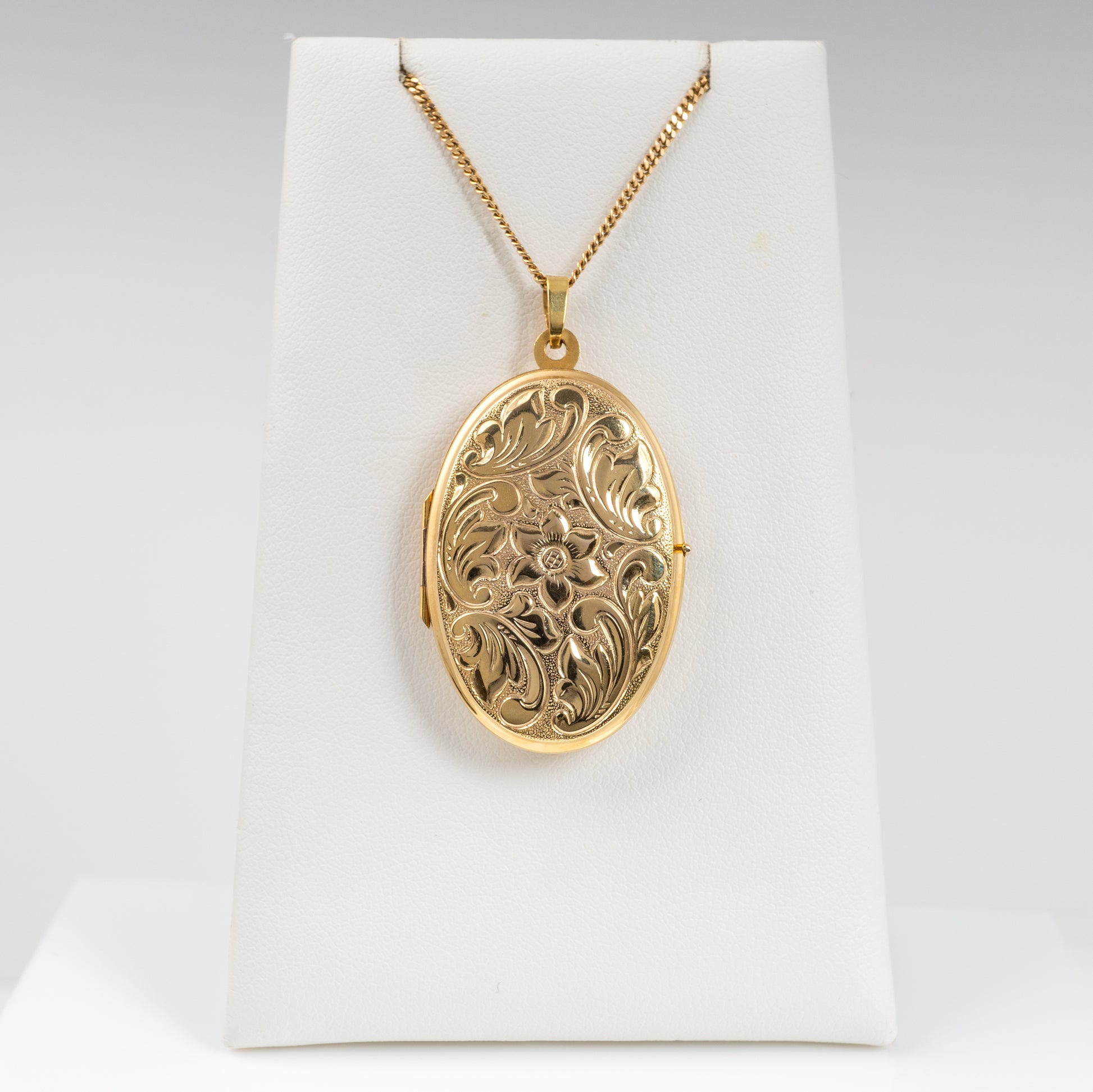 Elegant Gold Locket Necklace with Foliage Design