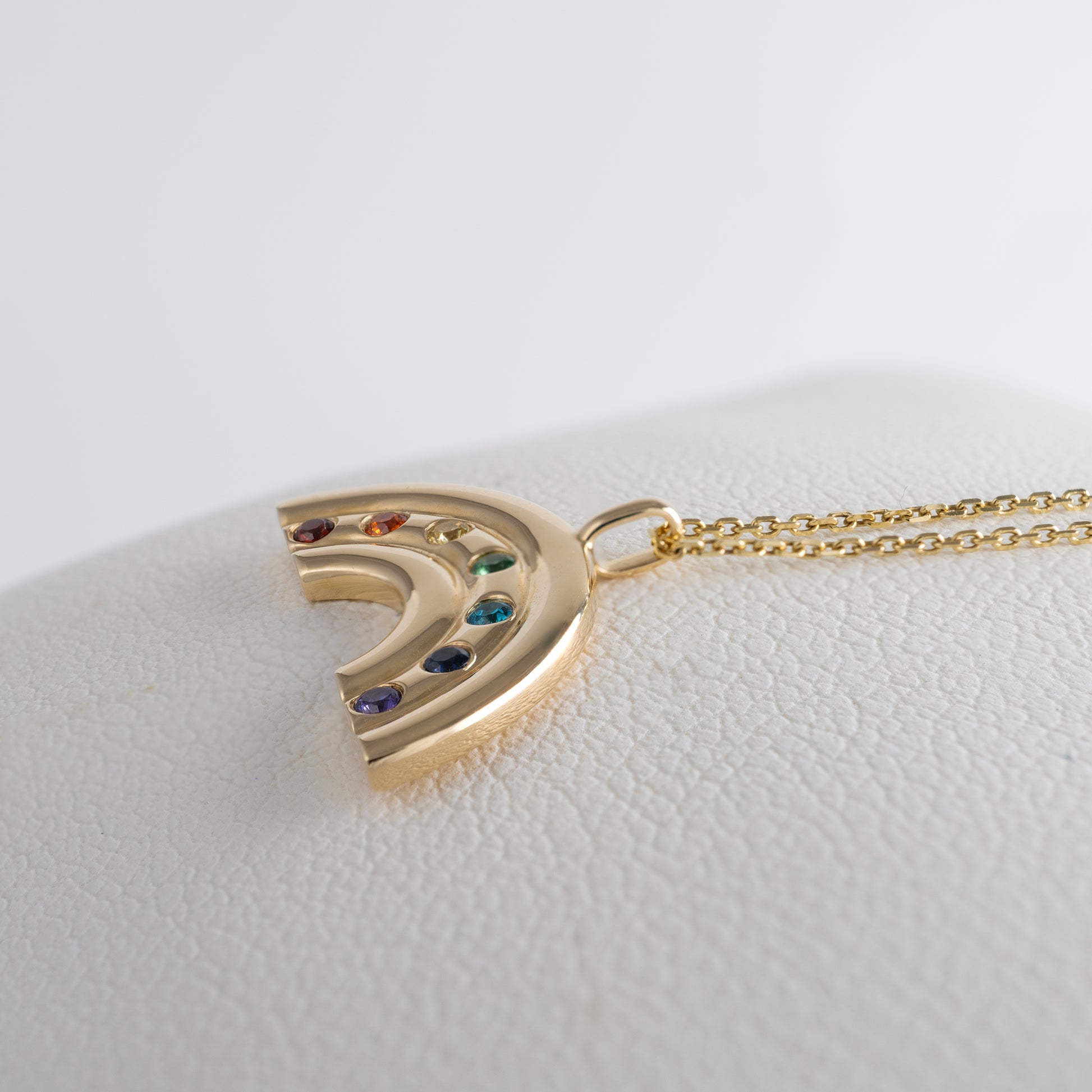 gold rainbow necklace side view with afixed bail