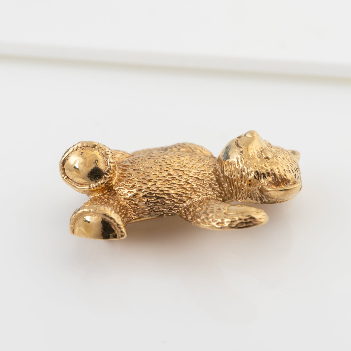 gold teddy bear brooch pin side view