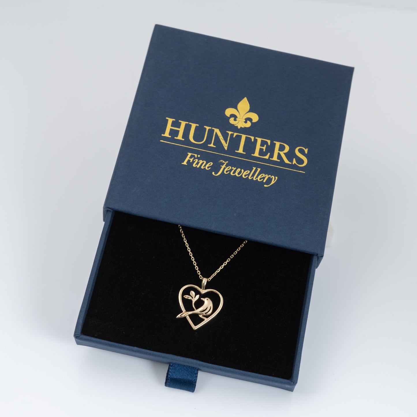 gold bird pendant in gift box by Hunters Fine Jewellery 