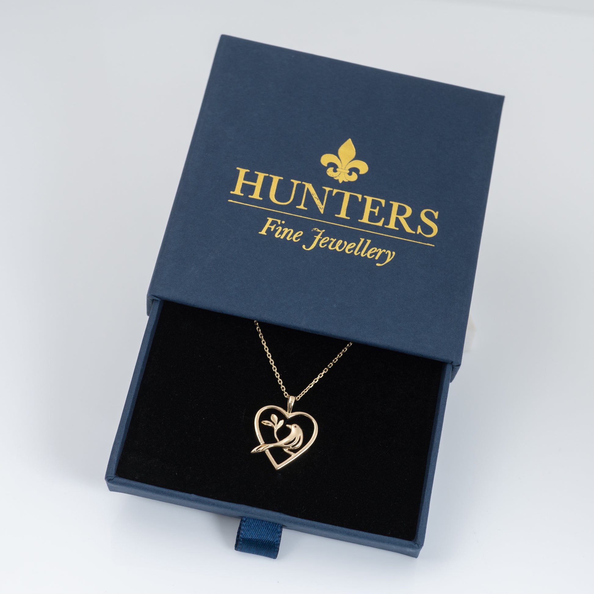 gold bird pendant in gift box by Hunters Fine Jewellery 