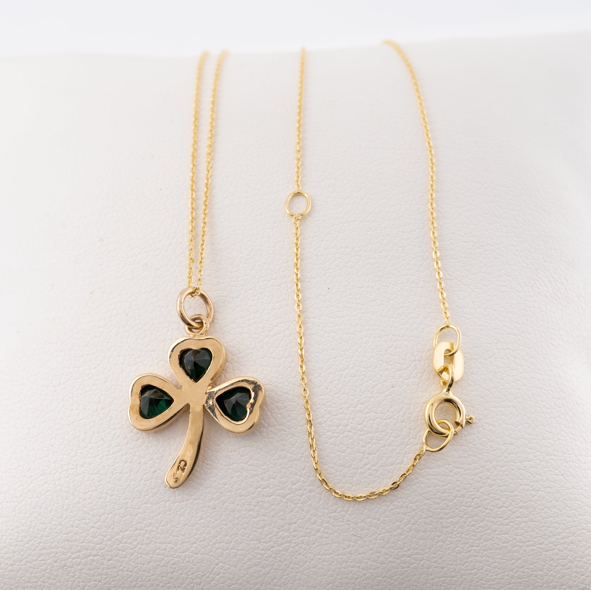 Reverse side of the gold shamrock necklace, showing the adjustable 9ct gold chain with spring ring clasp