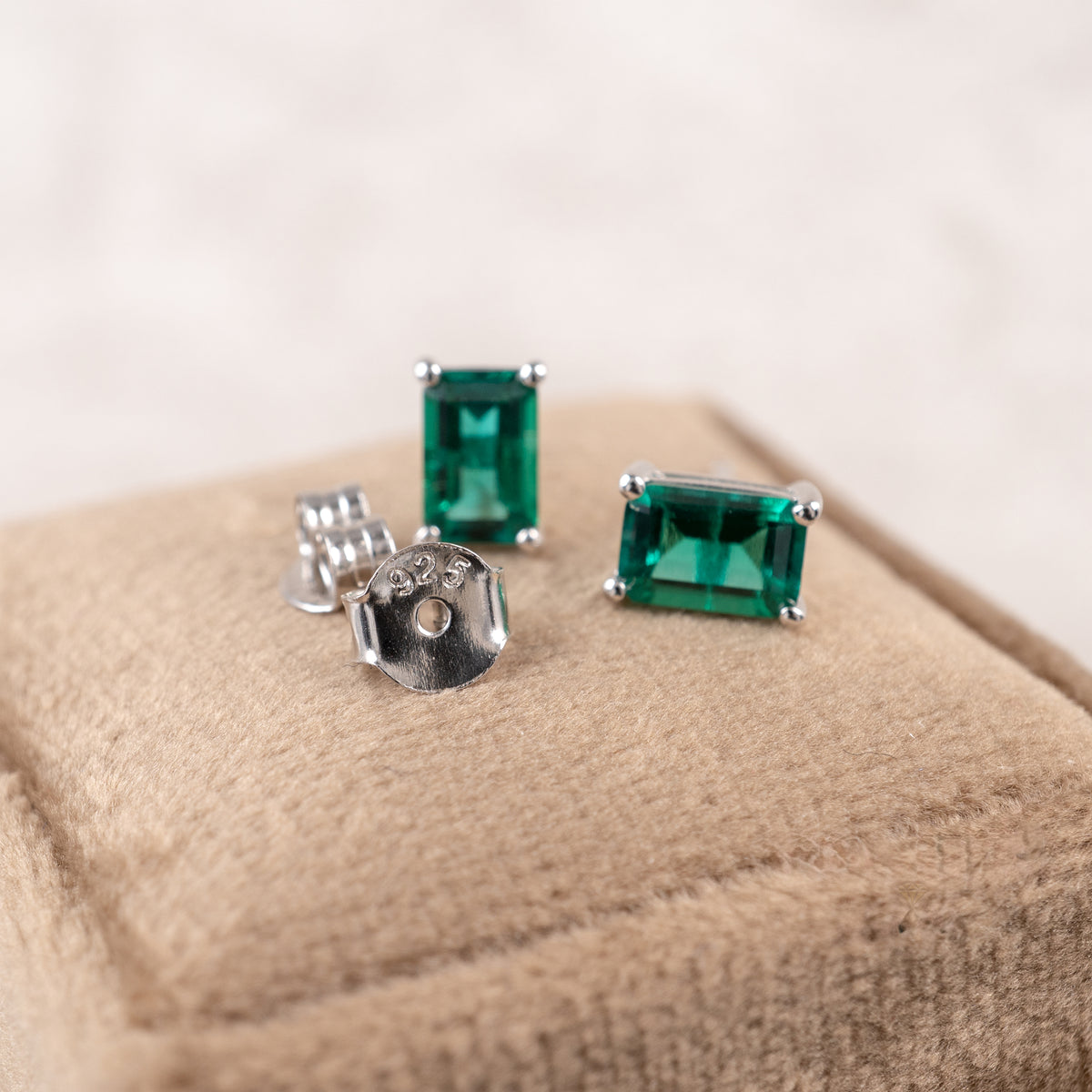 Lab-grown emerald stud earrings in rhodium-plated 925 sterling silver