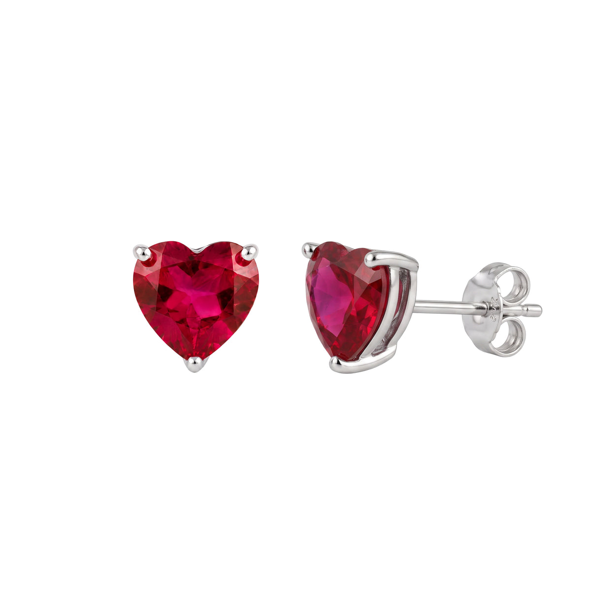A pair of lab grown ruby heart stud earrings in silver settings, with one earring facing forward and the other angled to show the post and backing, on a plain white background.
