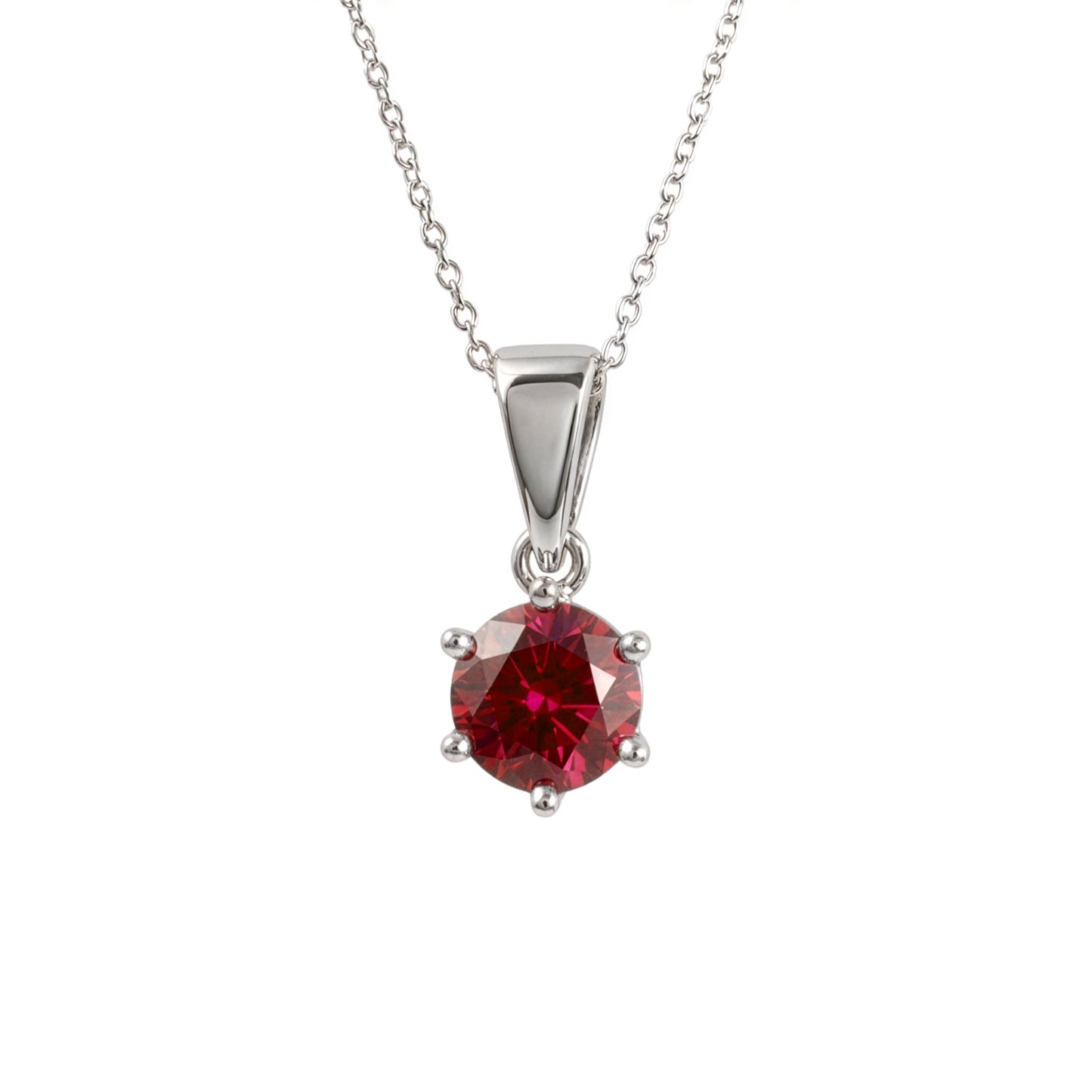  lab ruby pendant in sterling silver four-prong setting, suspended from a delicate silver chain against a plain white background.