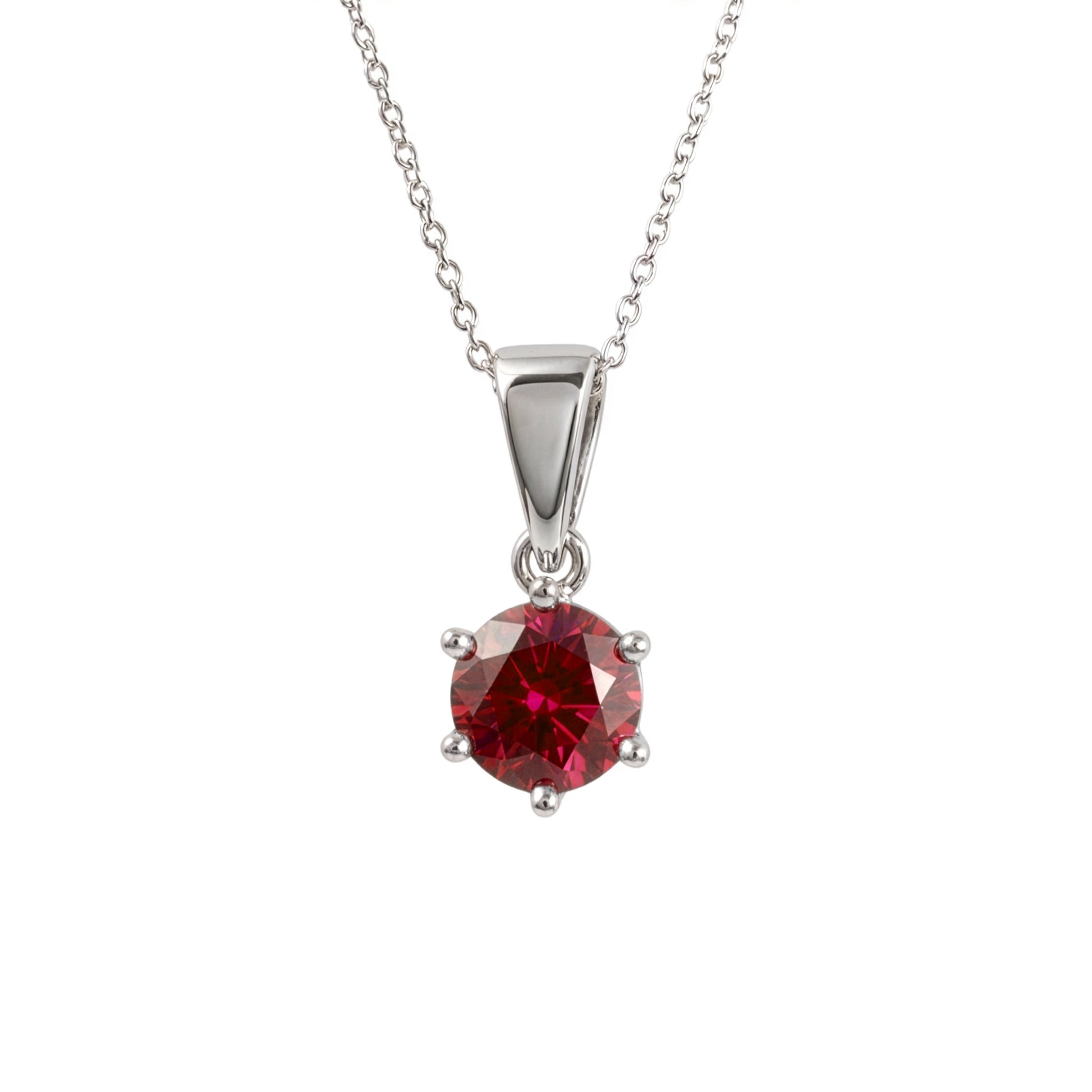  lab ruby pendant in sterling silver four-prong setting, suspended from a delicate silver chain against a plain white background.