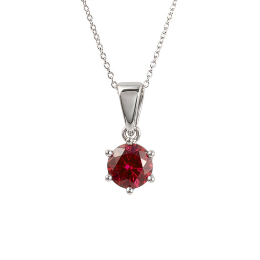  lab ruby pendant in sterling silver four-prong setting, suspended from a delicate silver chain against a plain white background.