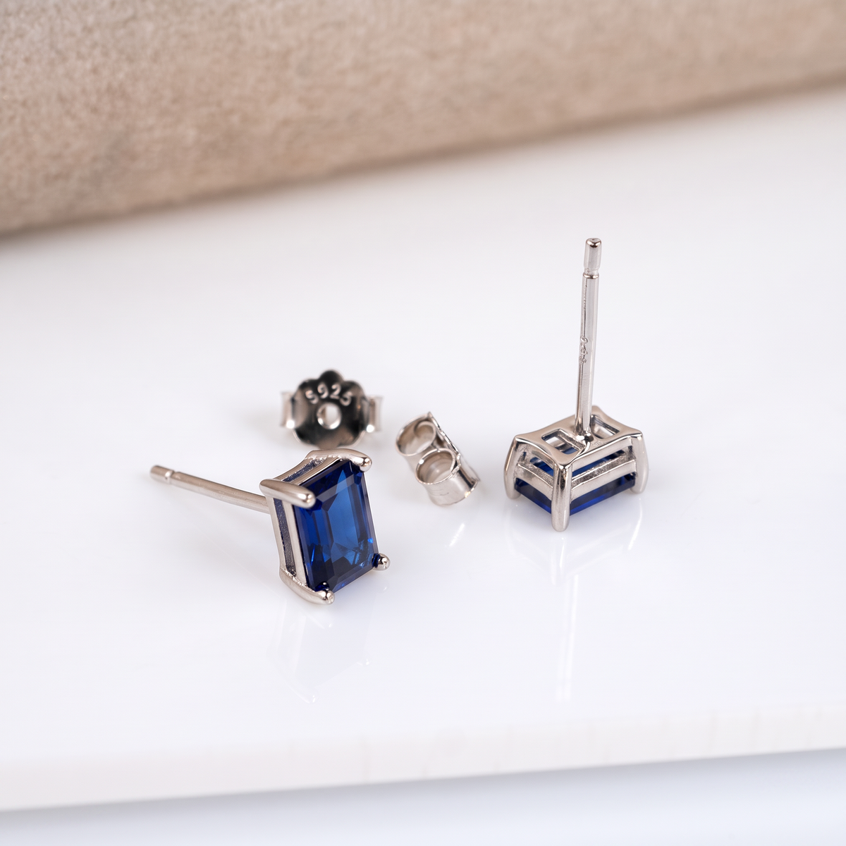 Lab sapphire stud earrings in sterling silver with butterfly backs stamped 925