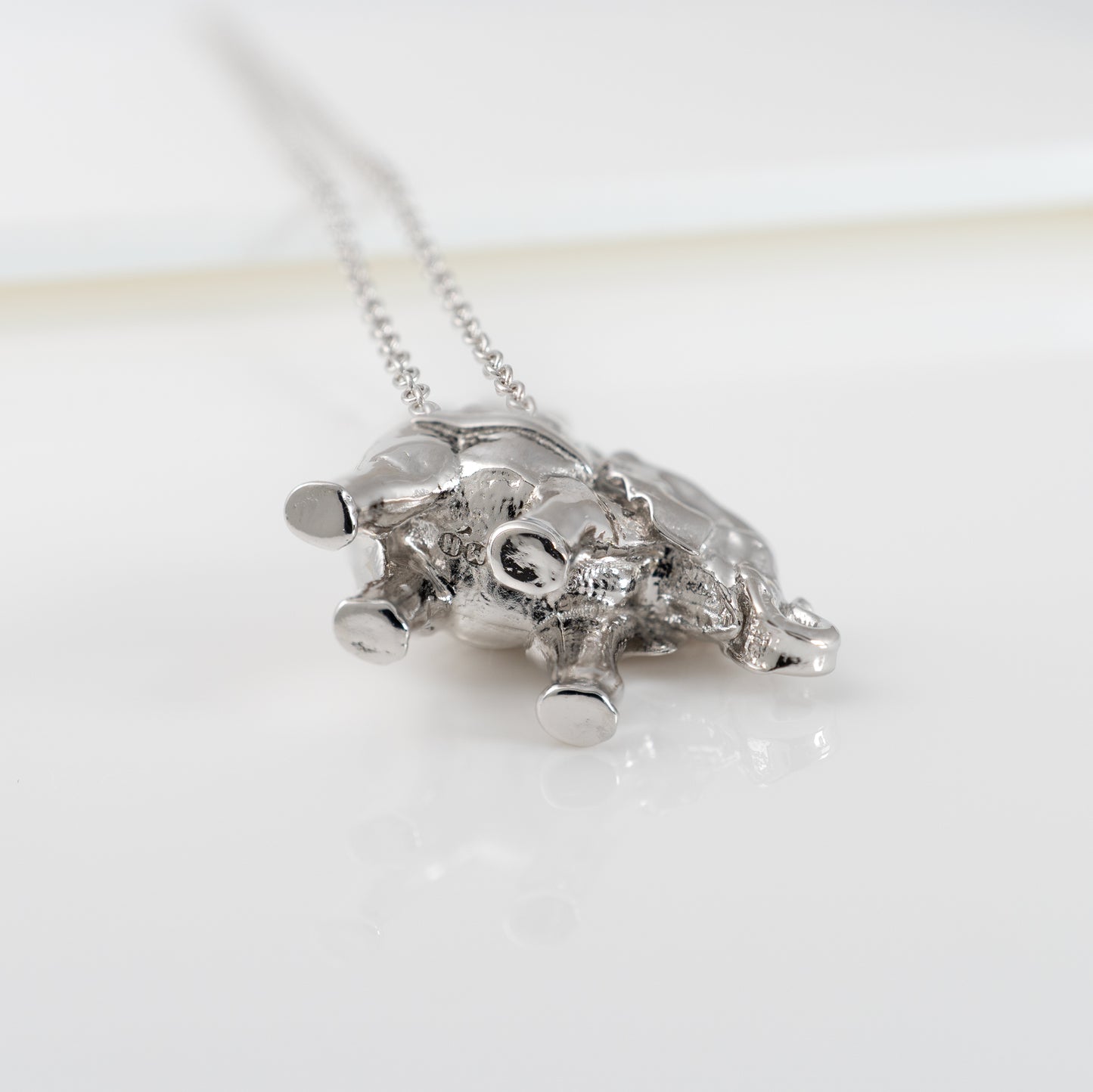 Underside view of lucky elephant necklace in sterling silver pendant