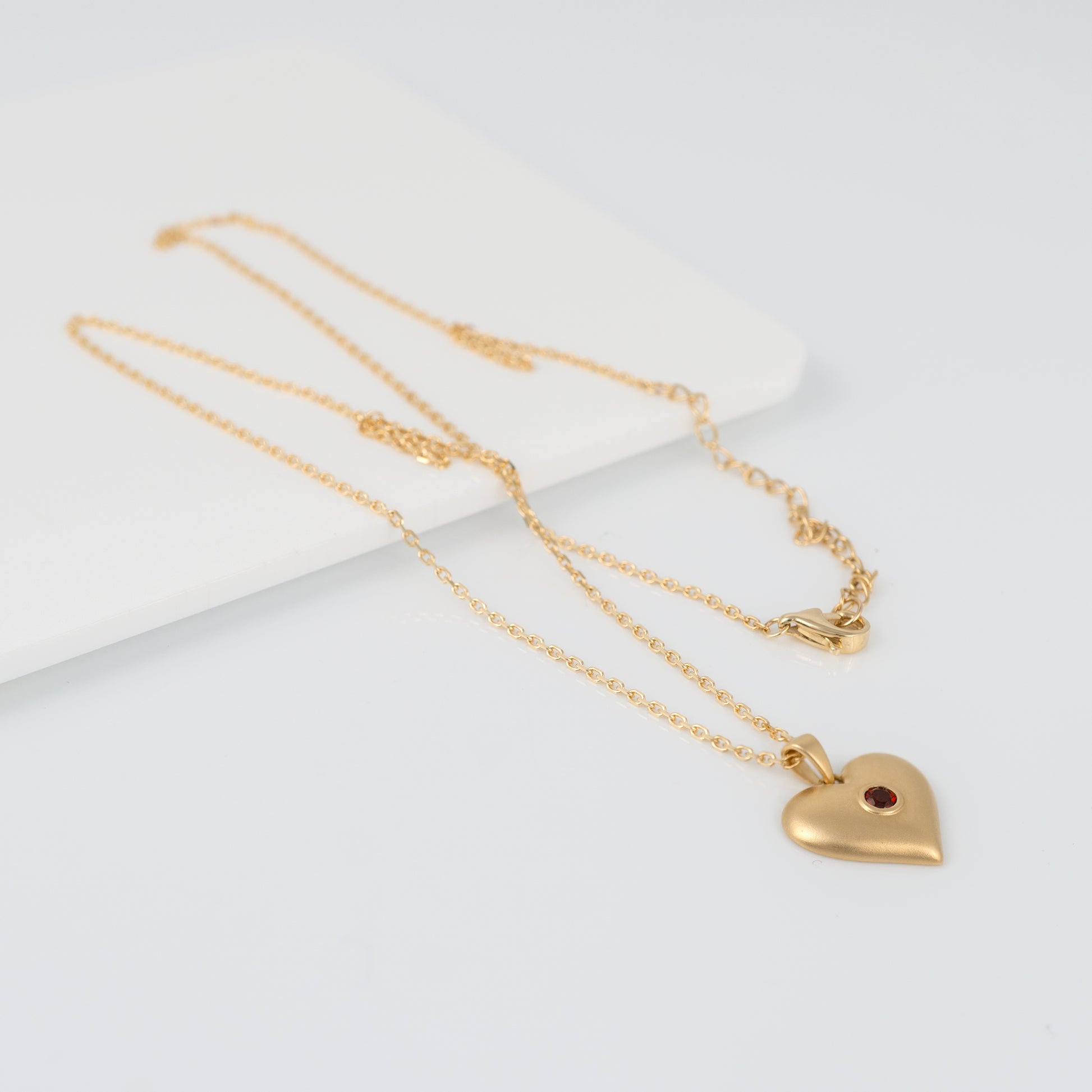 Matte gold heart necklace pendant showing adjustable chain