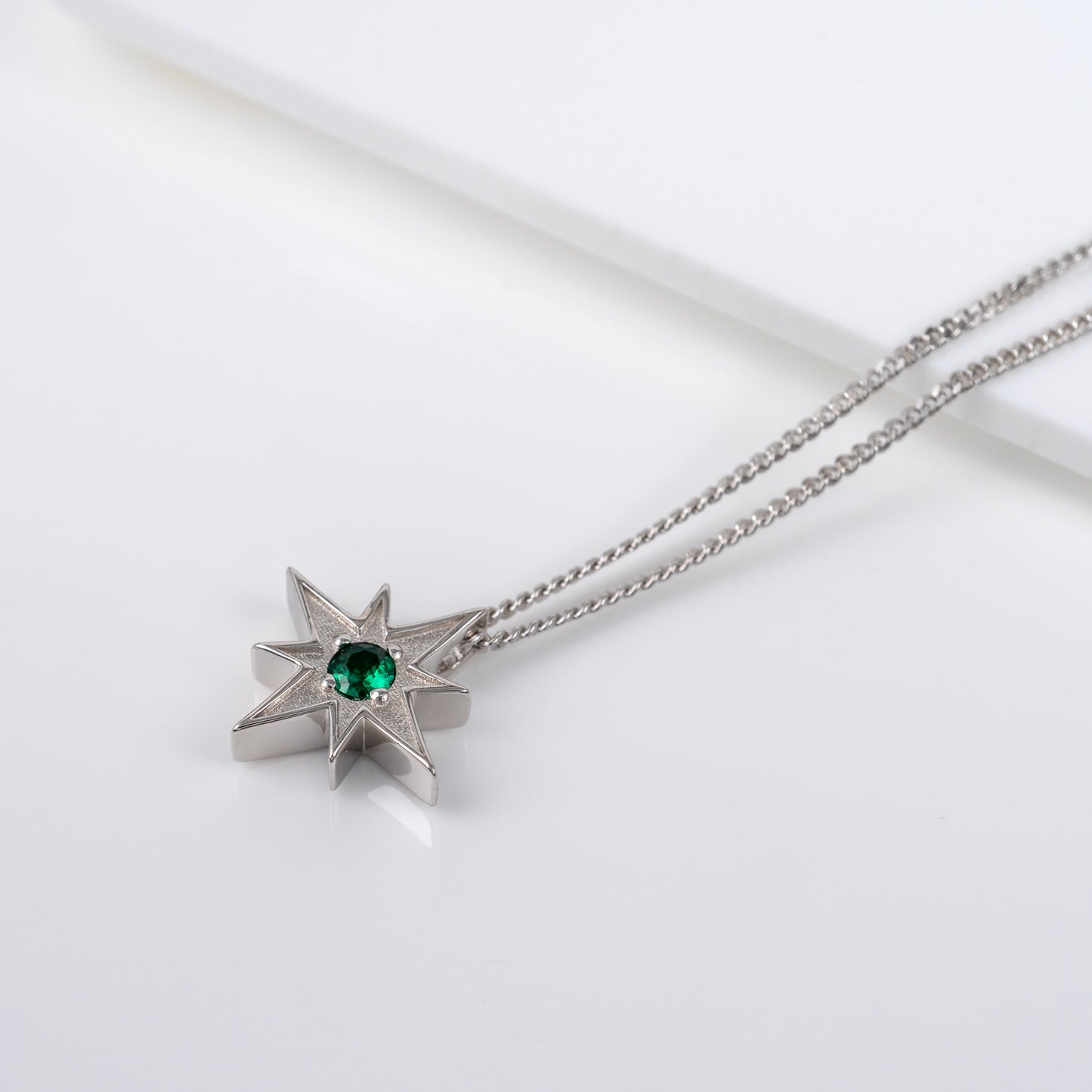 north star necklace in sterling silver with emerald green gemstone