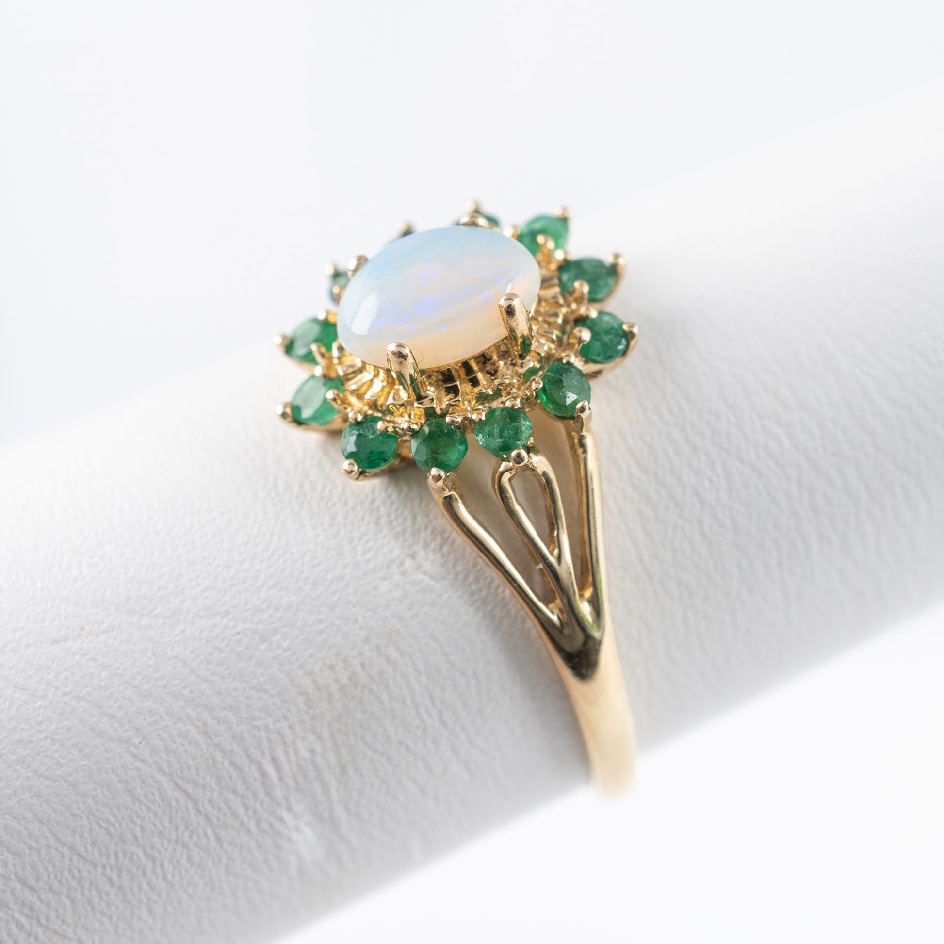 opal emerald halo ring yellow gold side view hunters fine jewellery