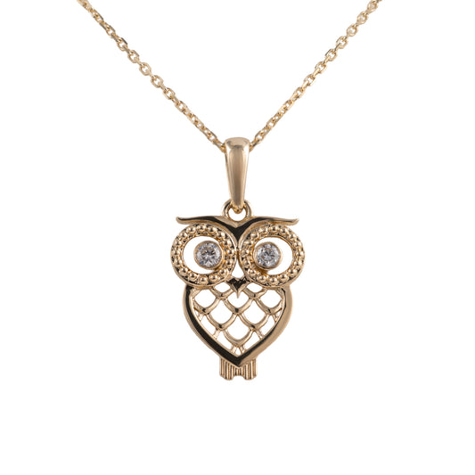 gold owl pendant with diamond eyes front on white background