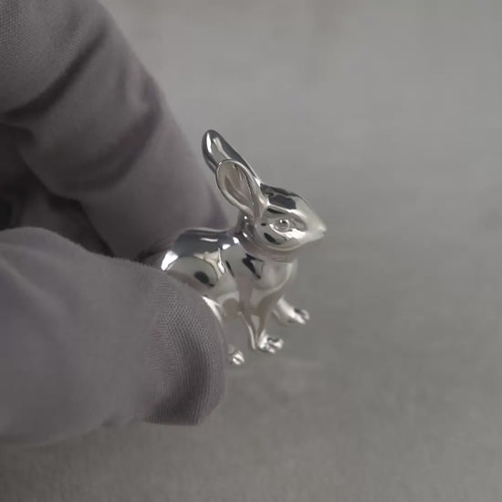 Video of sterling silver rabbit figurine hallmarked in Edinburgh, shown being handled with grey gloves to display finish and detail