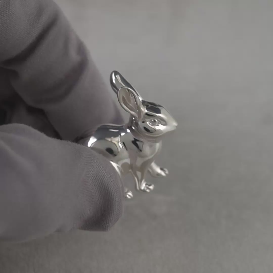 Video of sterling silver rabbit figurine hallmarked in Edinburgh, shown being handled with grey gloves to display finish and detail