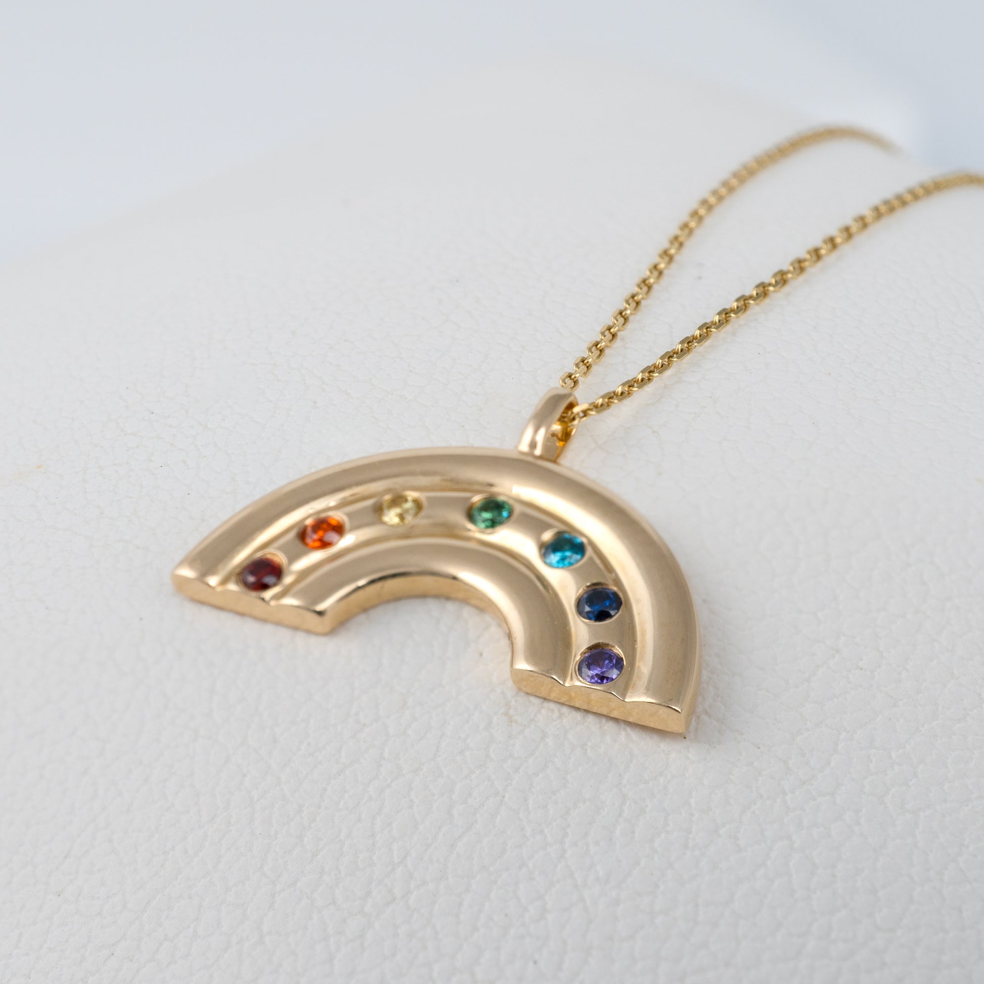 solid gold rainbow necklace close up side