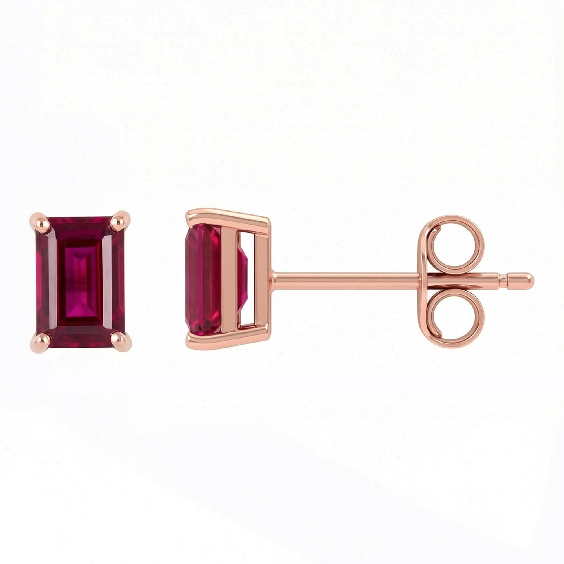 Rose gold earrings with lab rubies on a white background