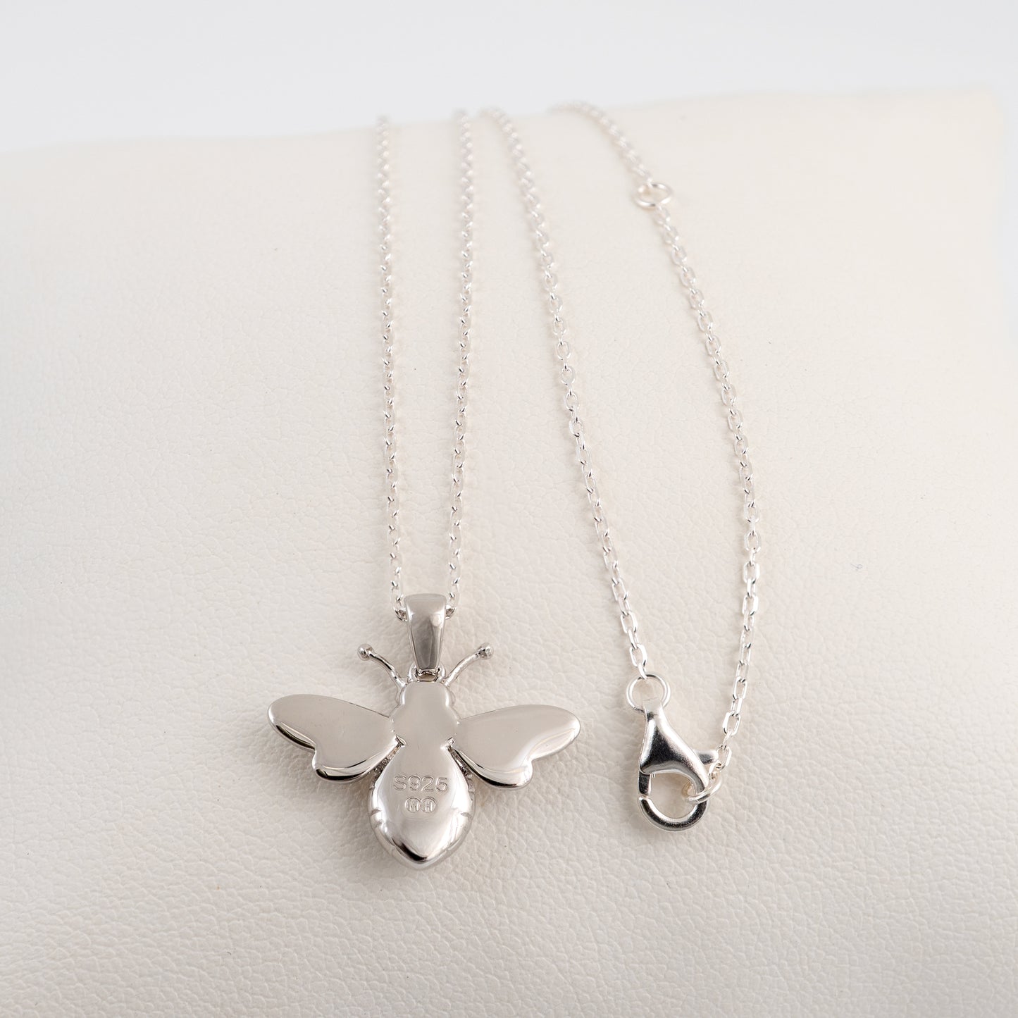 Back view of silver bee pendant necklace with lobster clasp