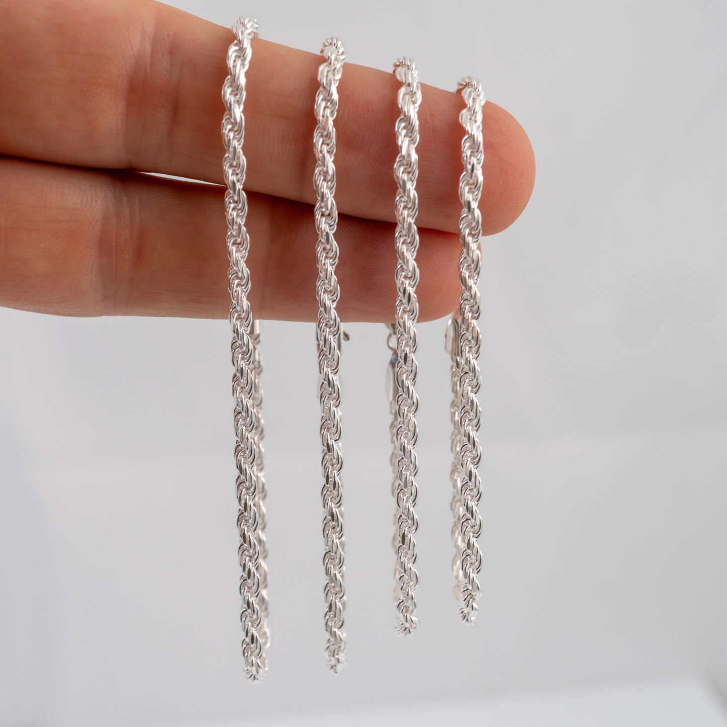 Four 3mm rope bracelets in silver showing different lengths