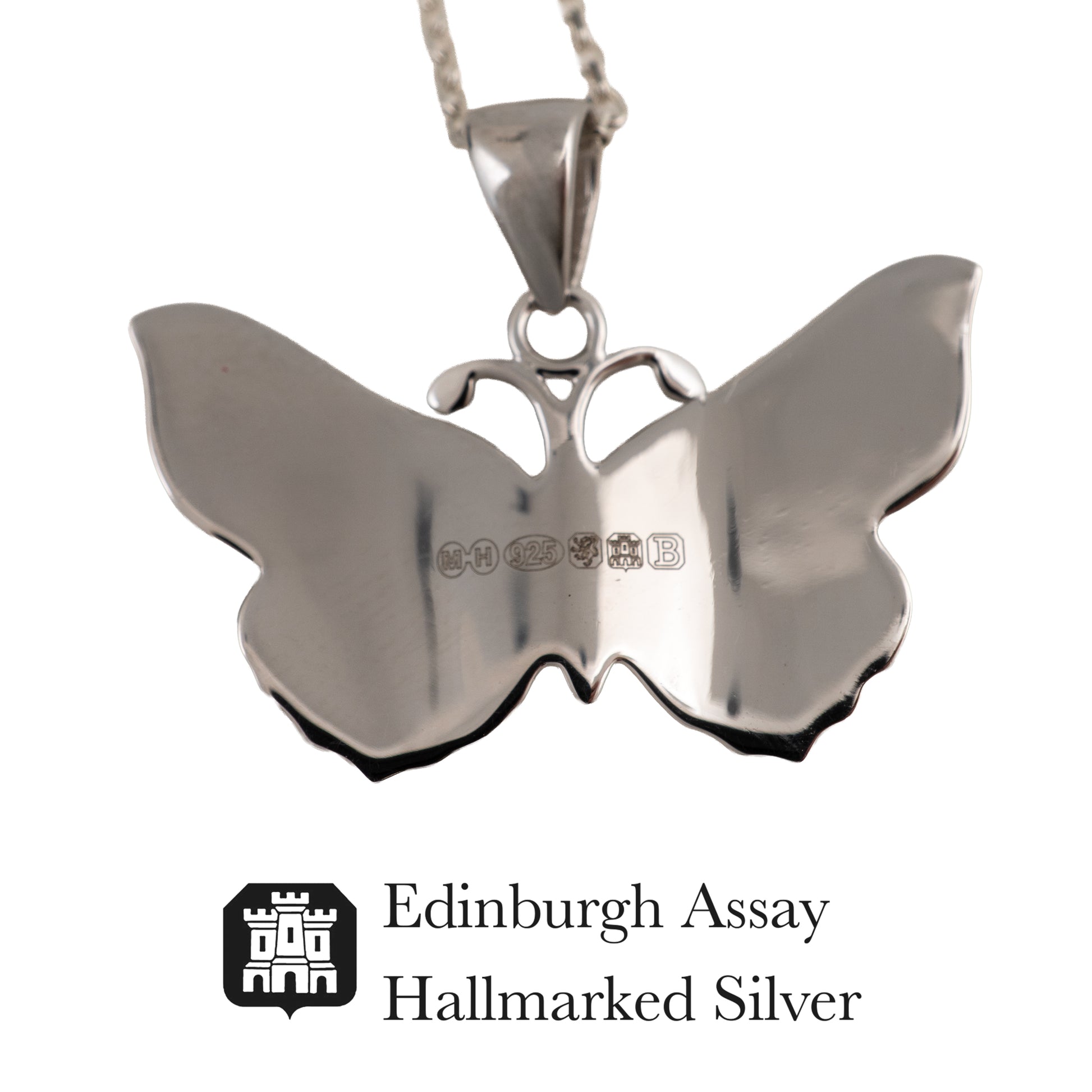 Silver butterfly pendant with 'Edinburgh Assay Hallmarked Silver' logo on a white background