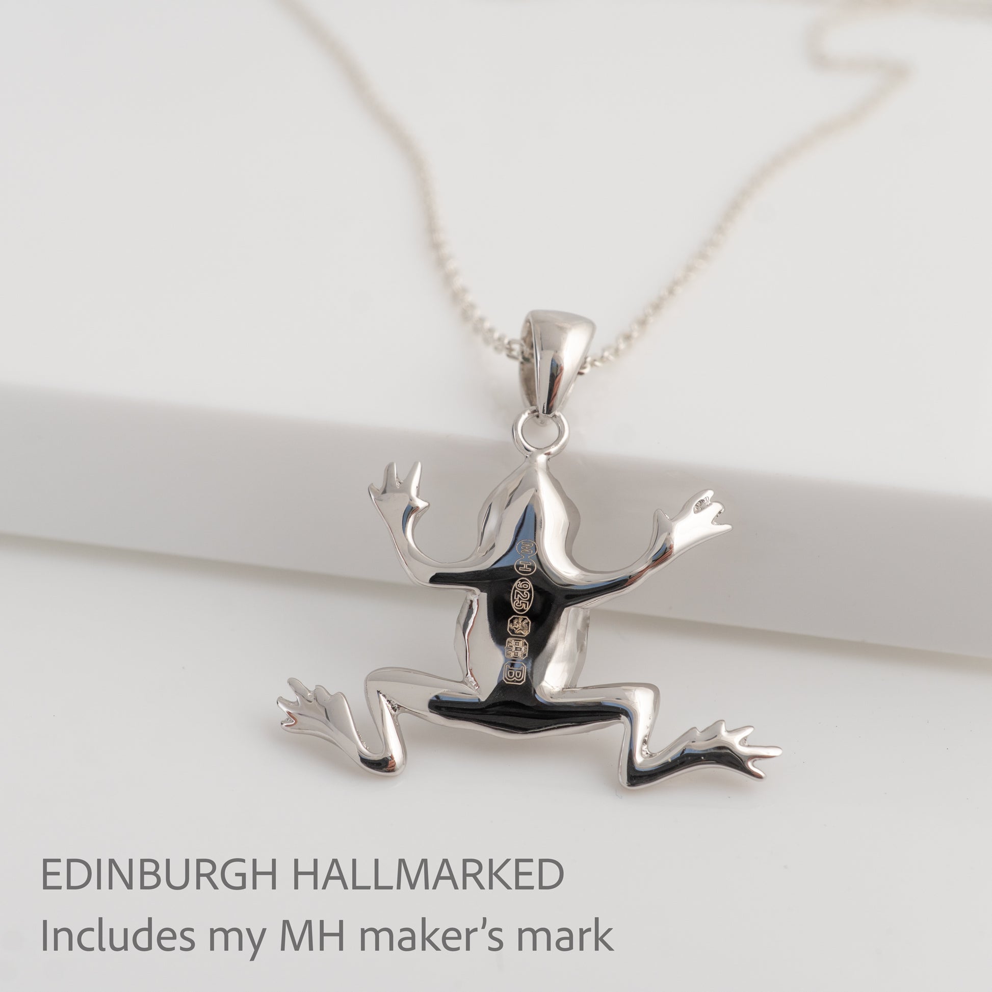 Silver frog pendant on a white background with 'Edinburgh Hallmarked' text.