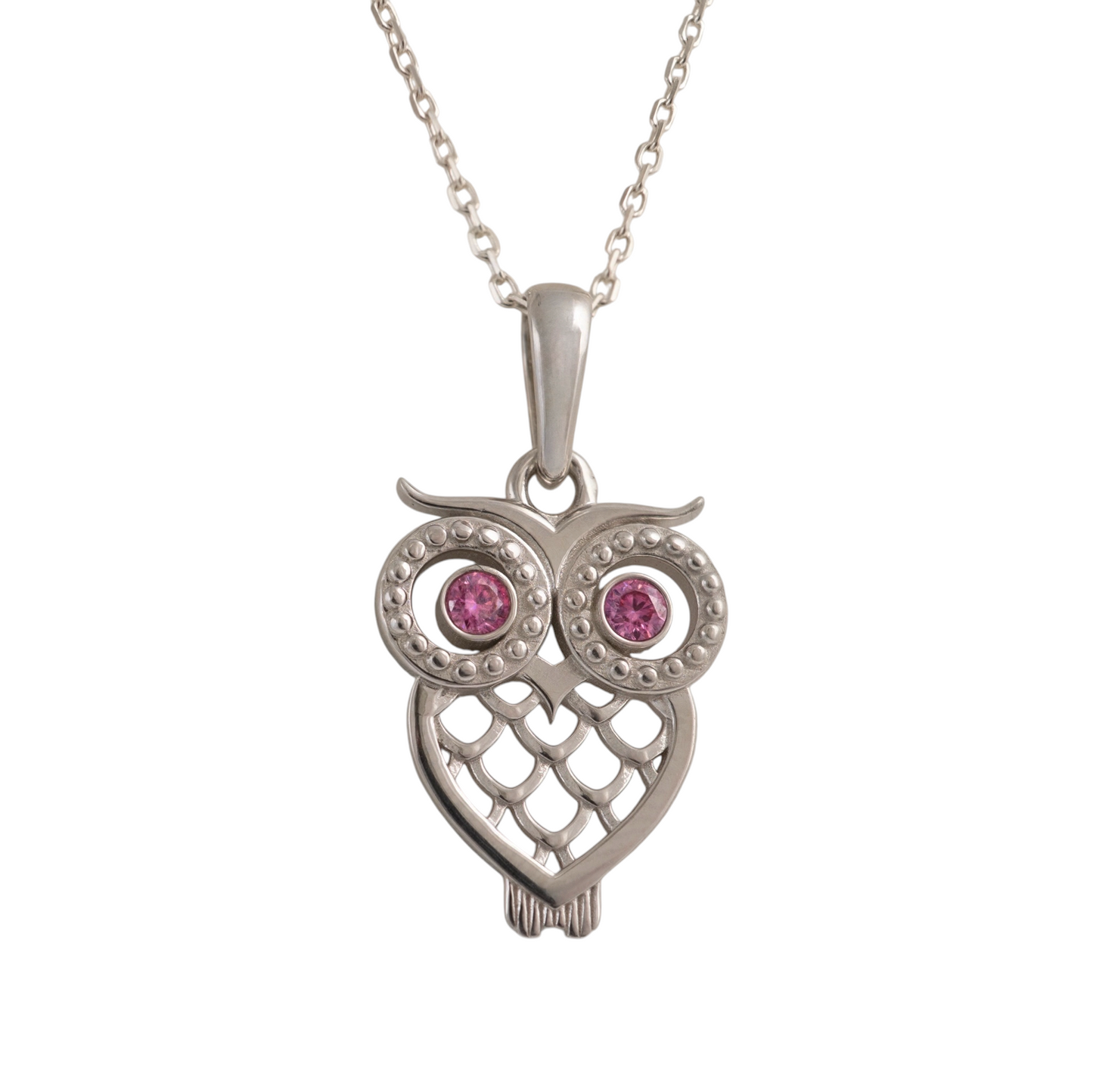Silver owl pendant with pink gemstones on a white background