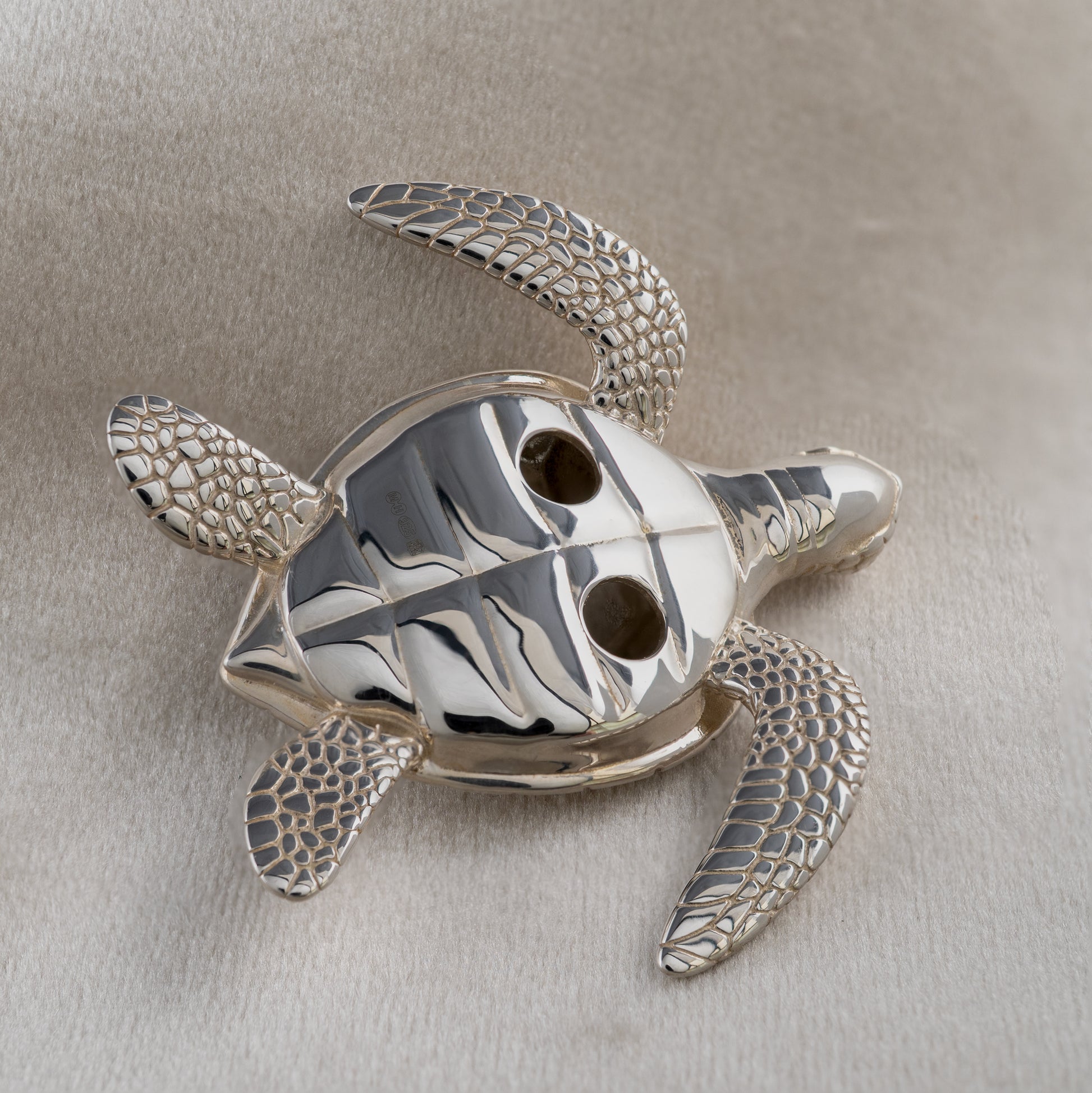 Underside of sterling silver sea turtle figurine showing hallmarked detail
