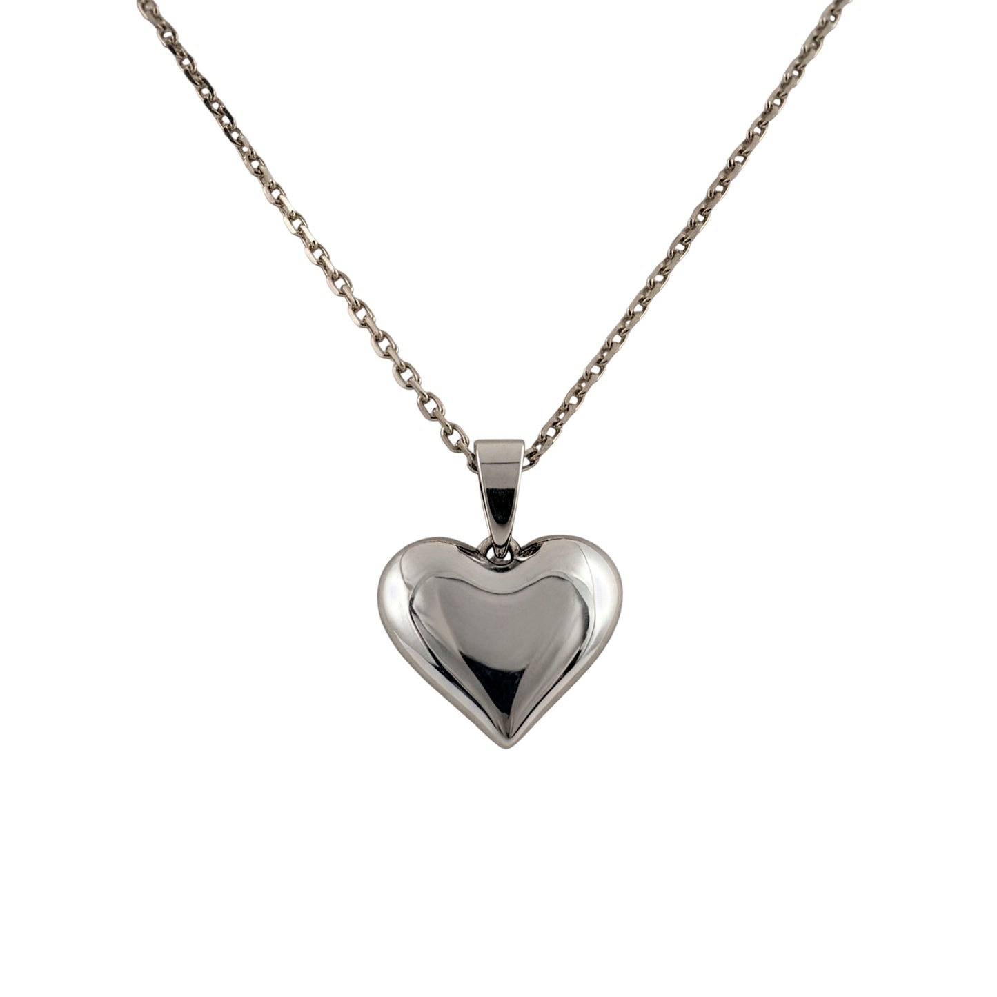 A polished silver heart-shaped pendant necklace on a delicate silver chain, shown against a plain white background.