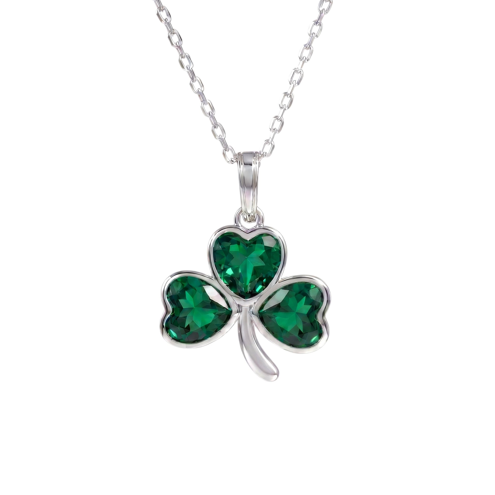 A sterling silver shamrock pendant necklace with three heart-shaped green crystals, shown on a white background.