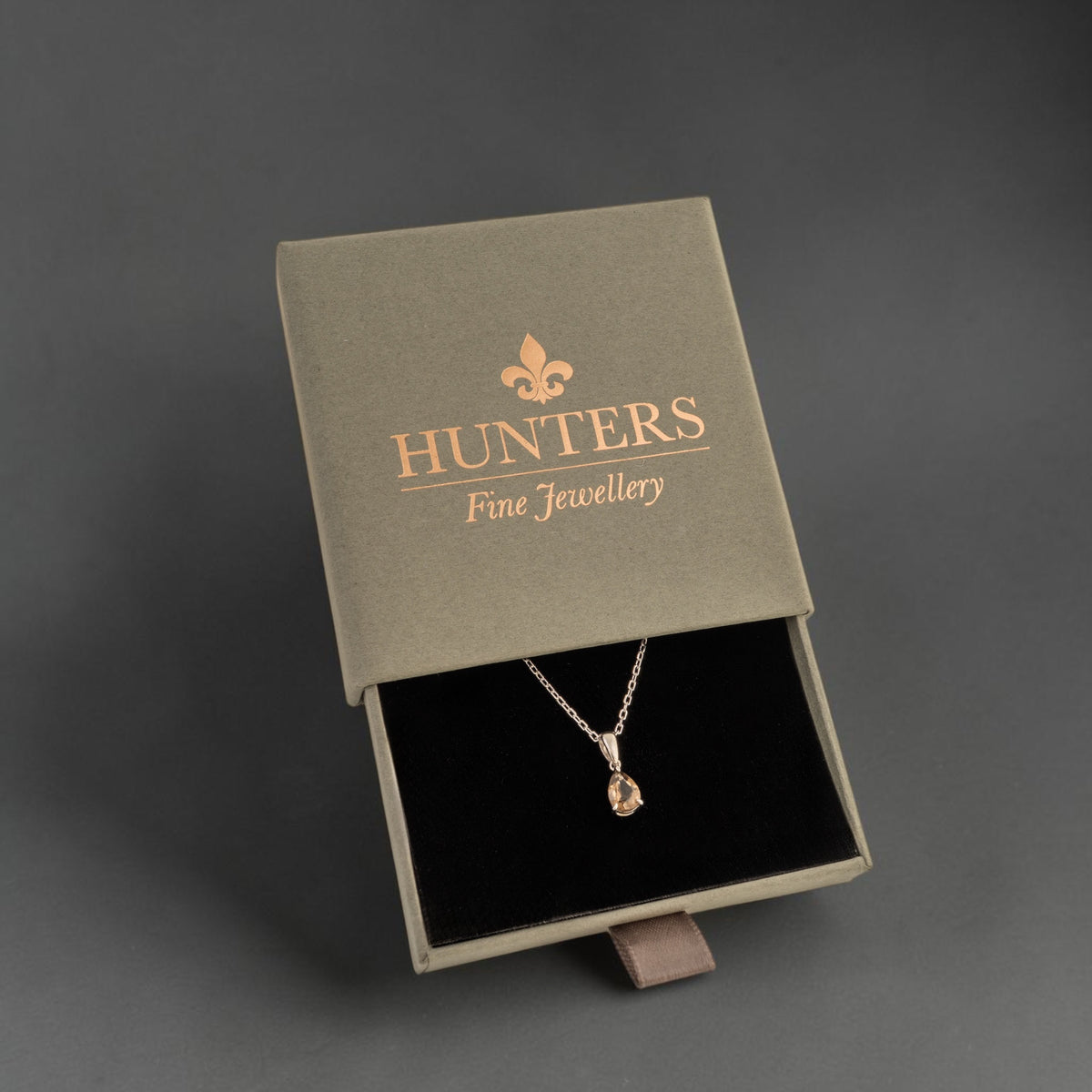 Smoky quartz pear-cut necklace in a HUNTERS Fine Jewellery presentation box.