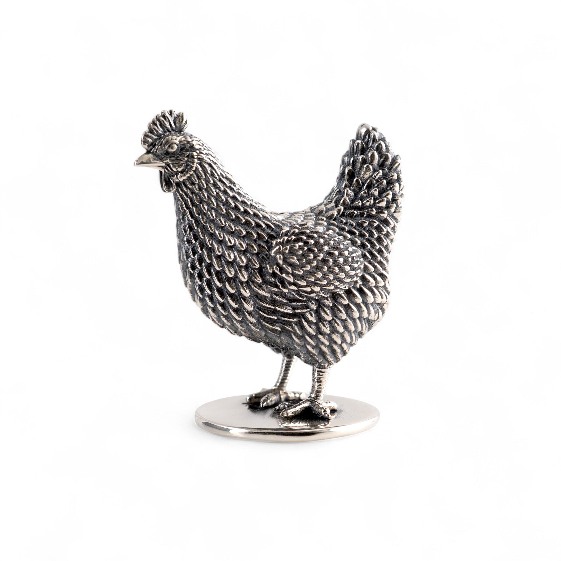 Silver hen figurine on a white background