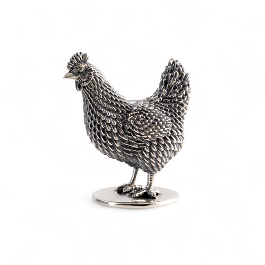 Silver hen figurine on a white background
