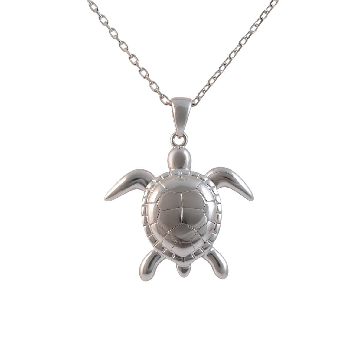Sterling silver sea turtle pendant with a detailed shell, hanging from a chain on a white background