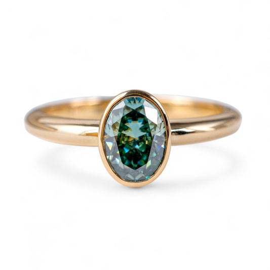 Teal moissanite ring oval yellow gold hunters fine jewellery  front view 
