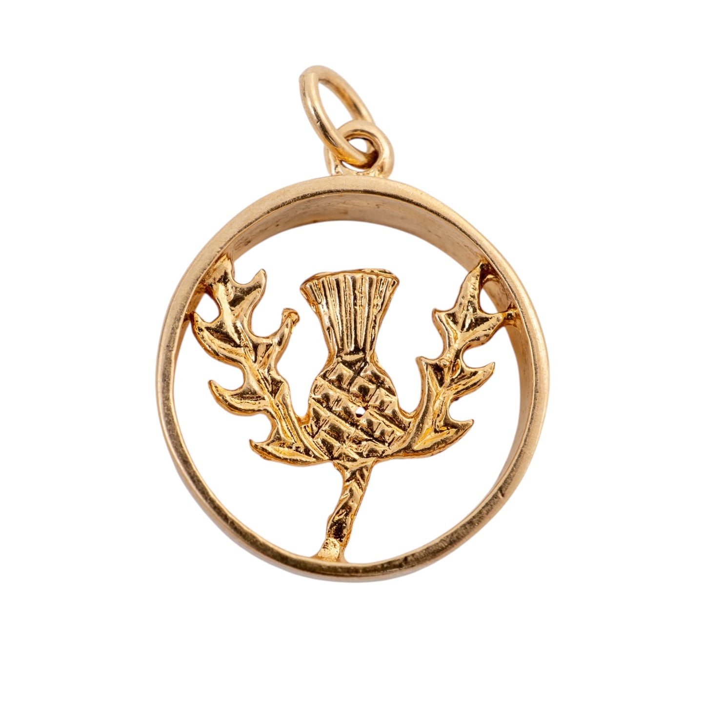 A 375 gold-Scottish thistle pendant charm featuring a circular frame with a raised thistle design in the centre, set against a plain white background.