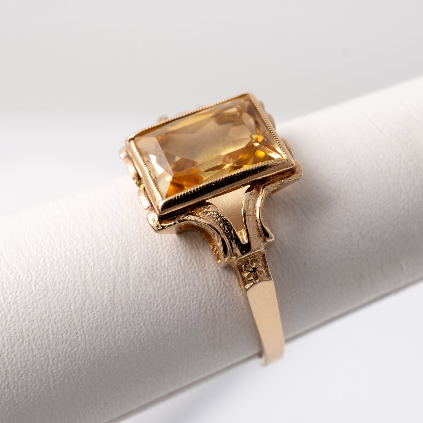 Citrine solitaire ring in 9ct gold showing the intricate design of the bifurcated shoulders and rectangular gemstone