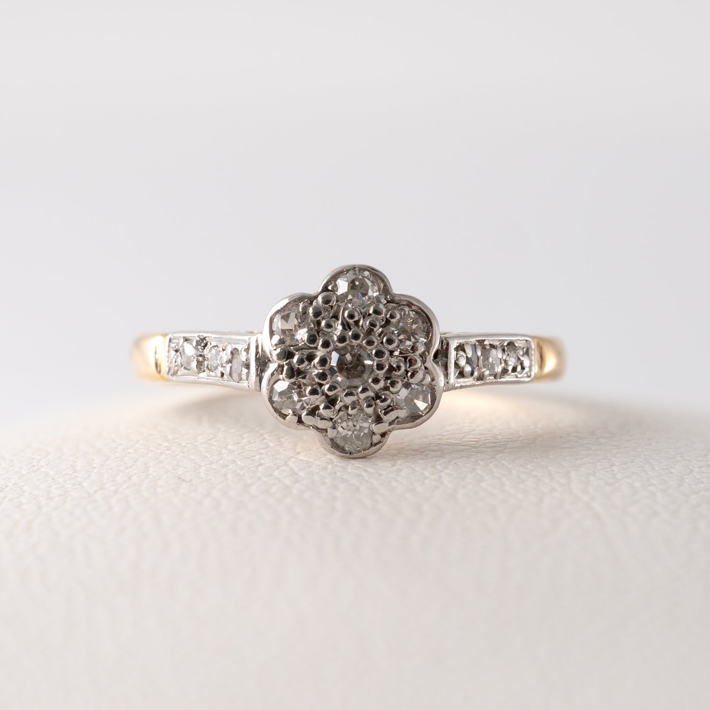 Front-facing view of a vintage diamond daisy ring in 18ct gold with platinum setting – Hunters Fine Jewellery.