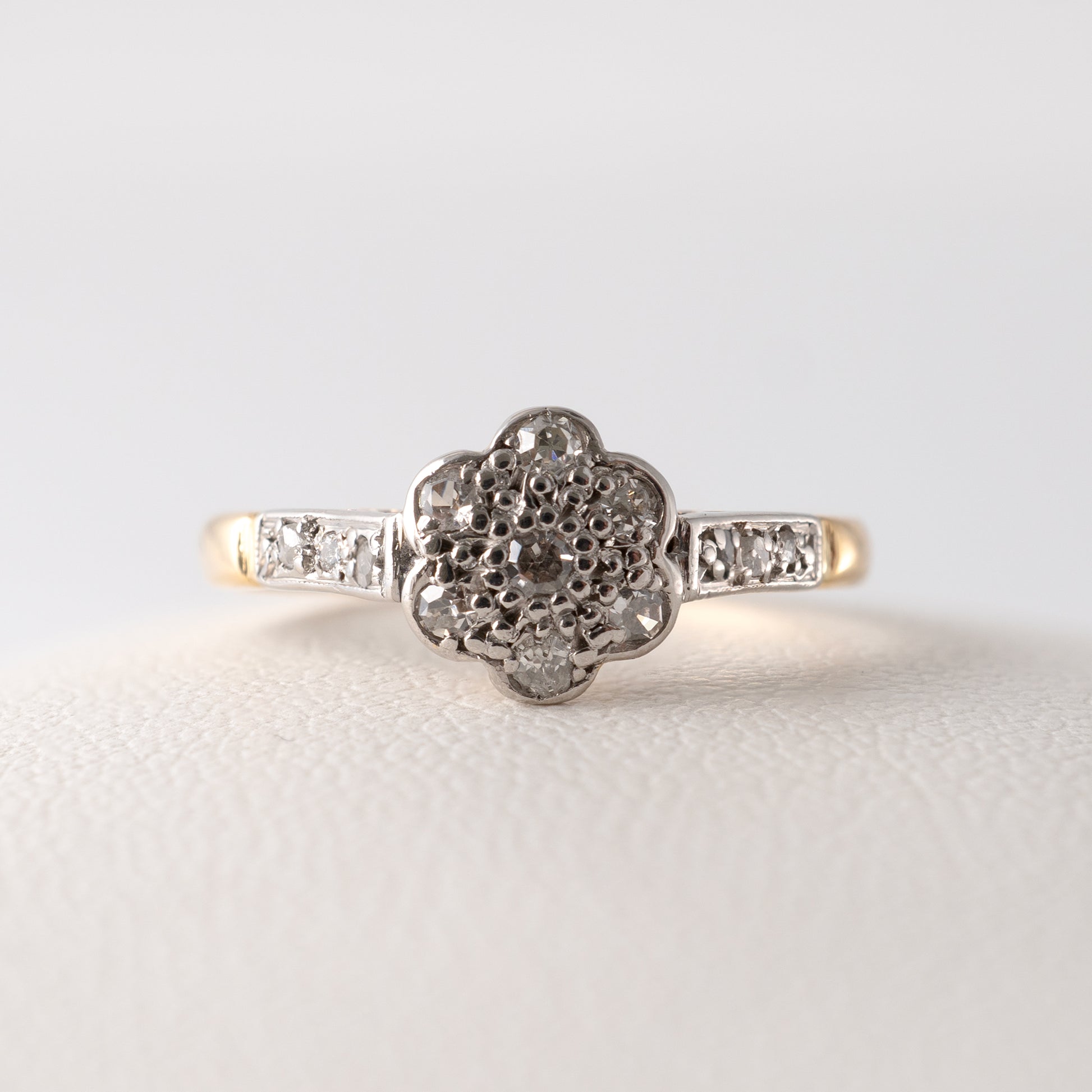 Front-facing view of a vintage diamond daisy ring in 18ct gold with platinum setting – Hunters Fine Jewellery.