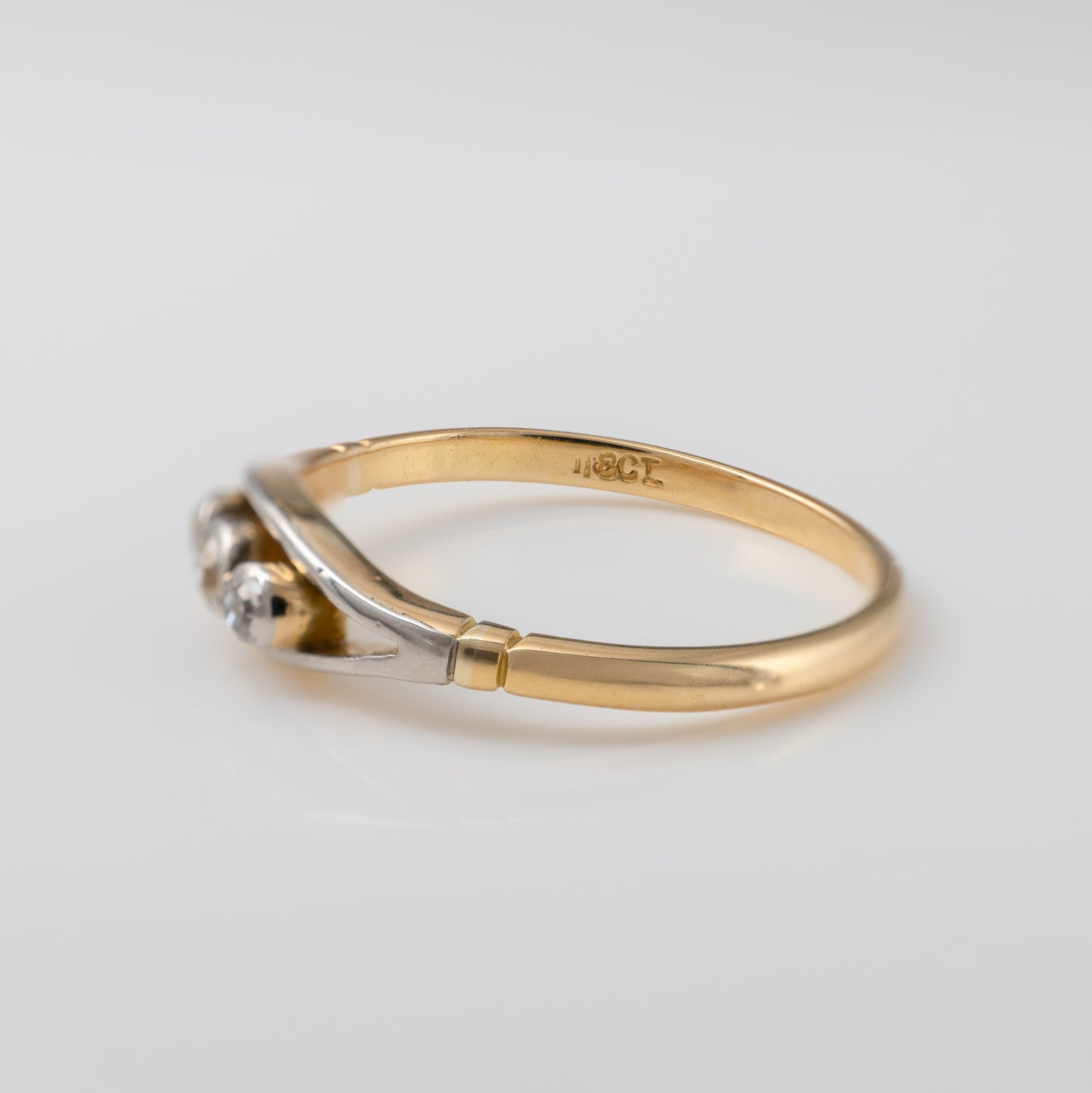 Close-up of vintage diamond ring in 18ct gold, highlighting old-cut diamonds and white gold setting