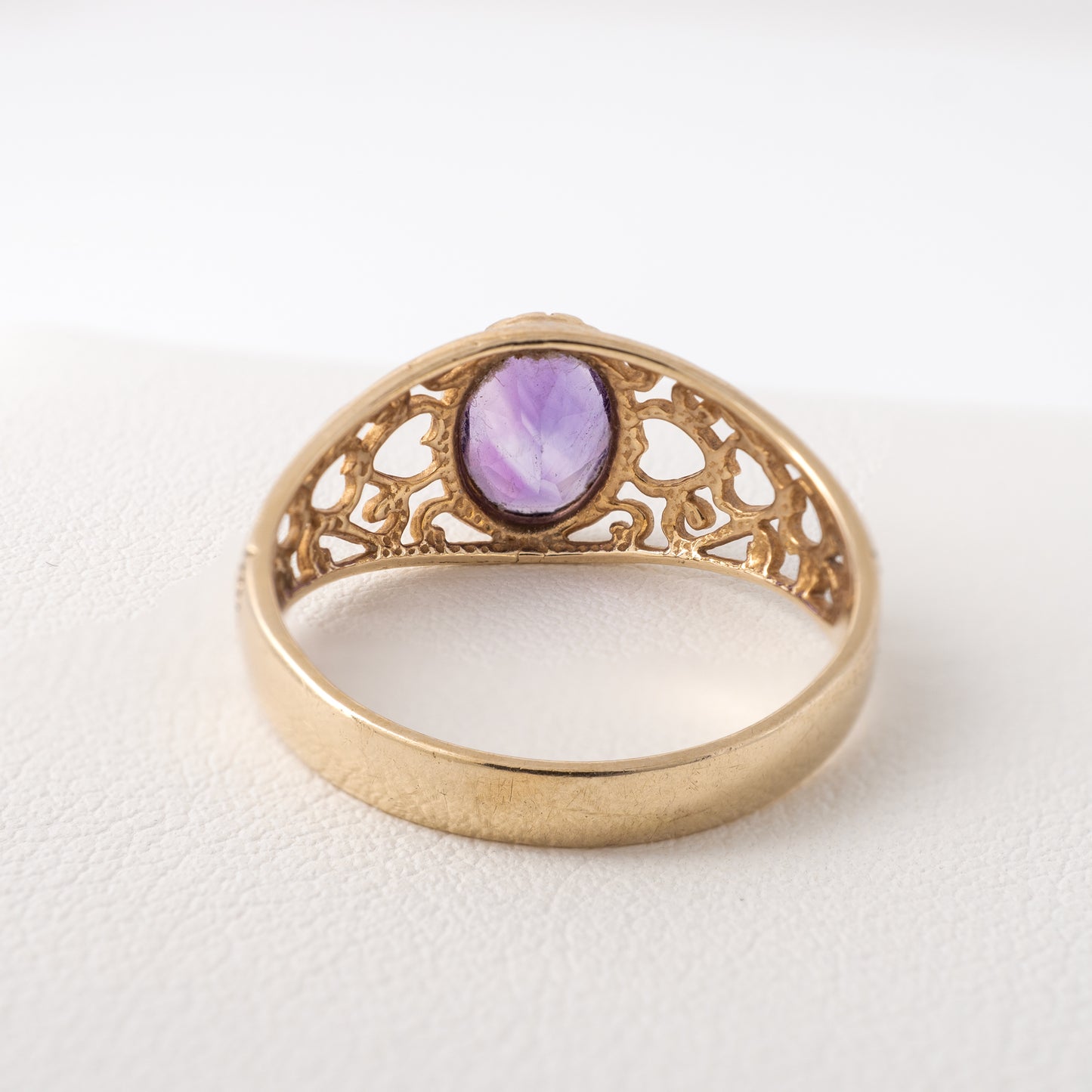 Vintage amethyst solitaire ring in 9ct yellow gold, showcasing hallmark and tapered shank